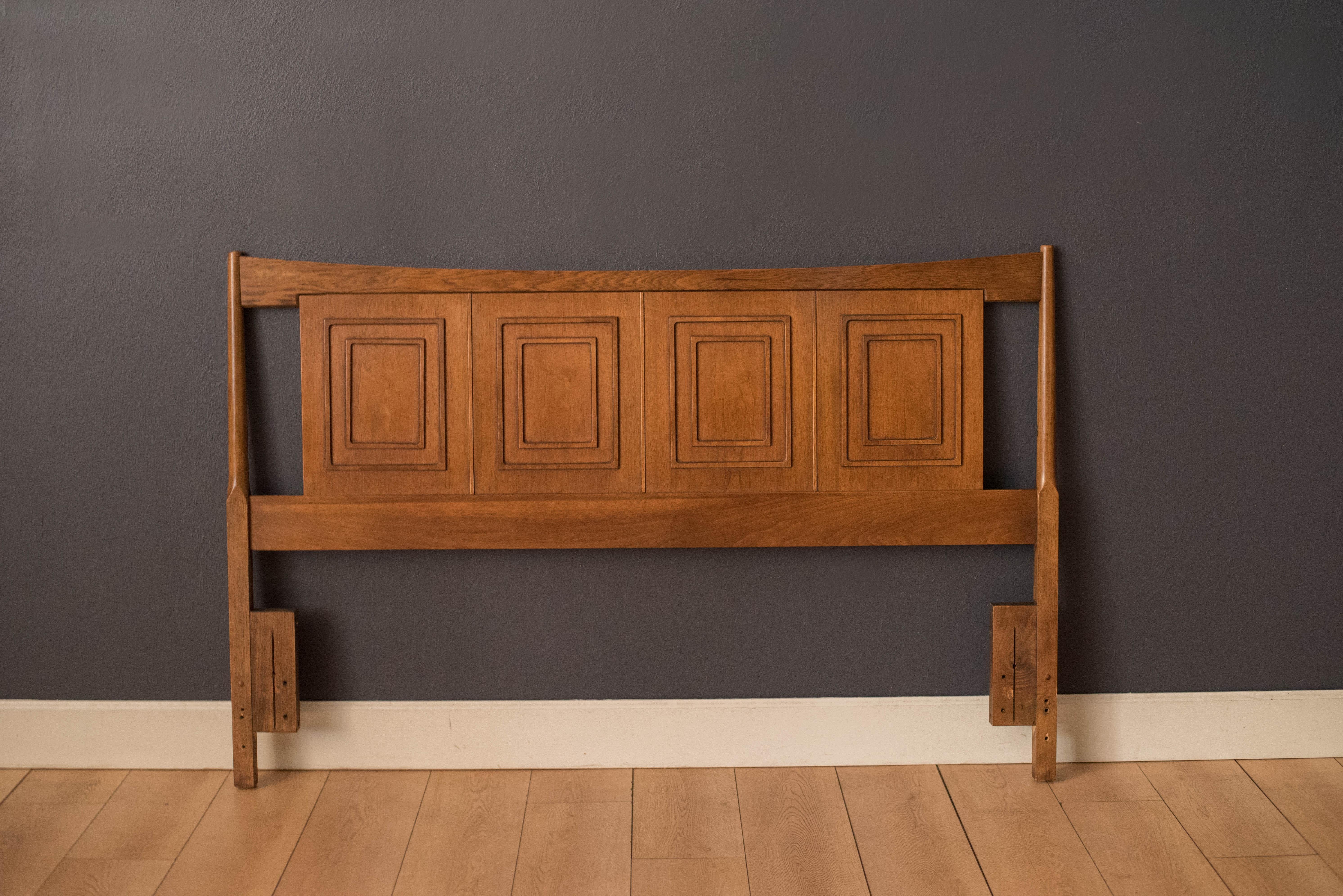 Vintage Broyhill Sculptra queen size headboard in walnut and oak circa 1960's. This piece displays the line's signature inset picture frame design and sculpted arches.