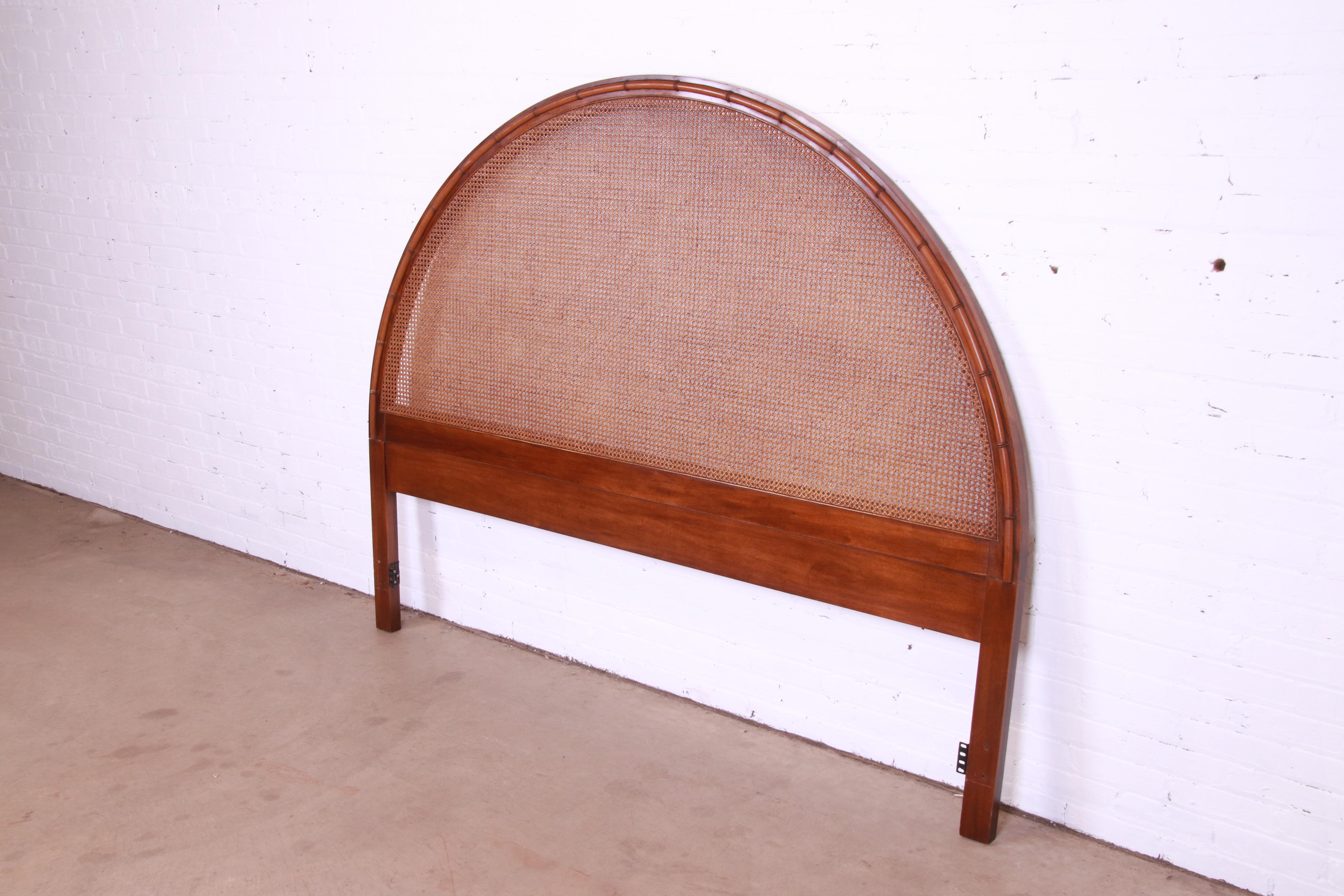 A gorgeous Mid-Century Modern Hollywood Regency king size headboard

USA, Circa 1960s

Walnut, cane, and faux bamboo in dramatic arched form.

Measures: 80