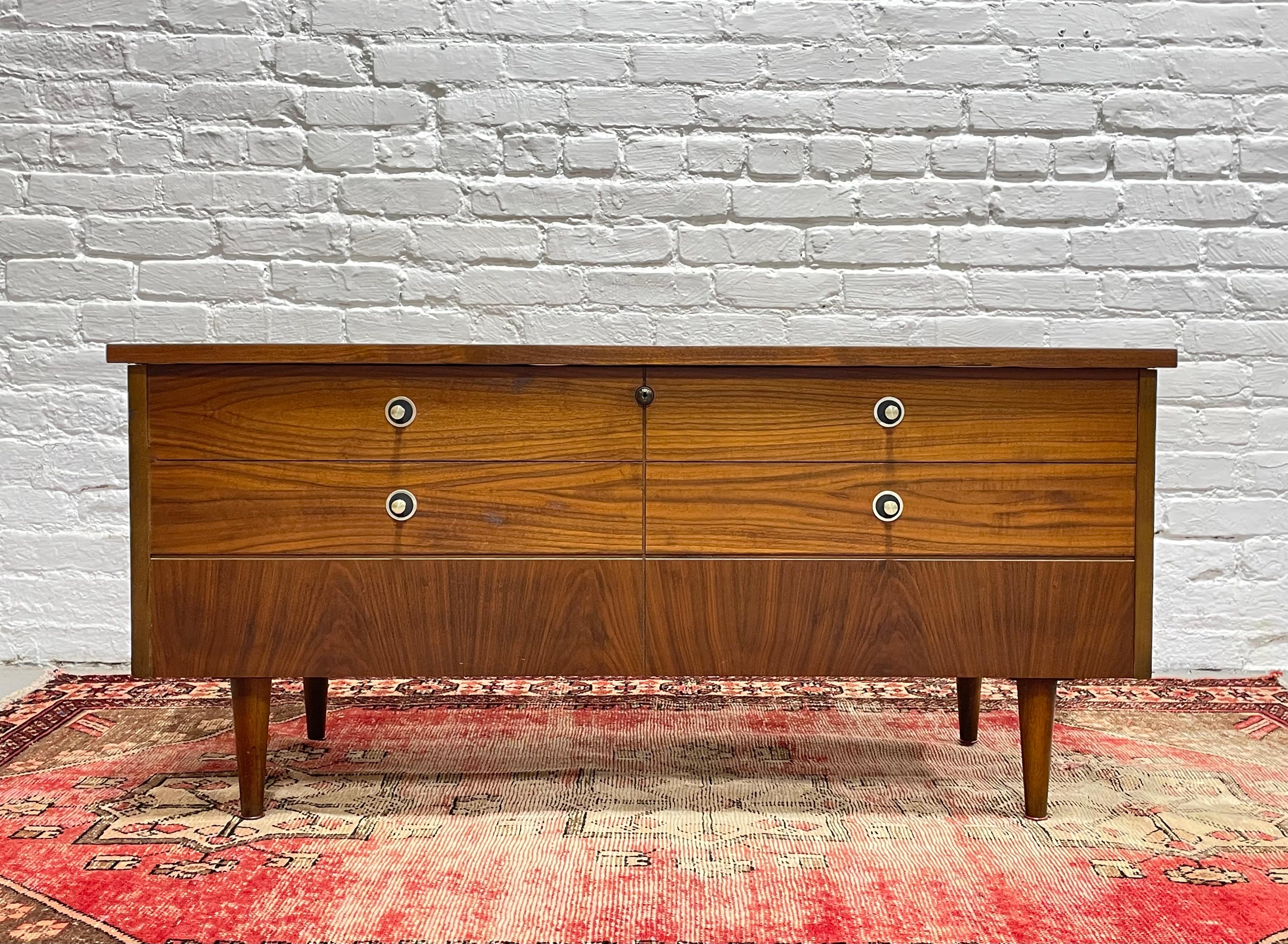 ** Please note that the lock mechanism will be disabled for safety compliance. Lane sends a free replacement safety lock upon request.**

Mid Century Modern walnut chest / bench by Lane in nearly new condition.  This chest is perfect for storing