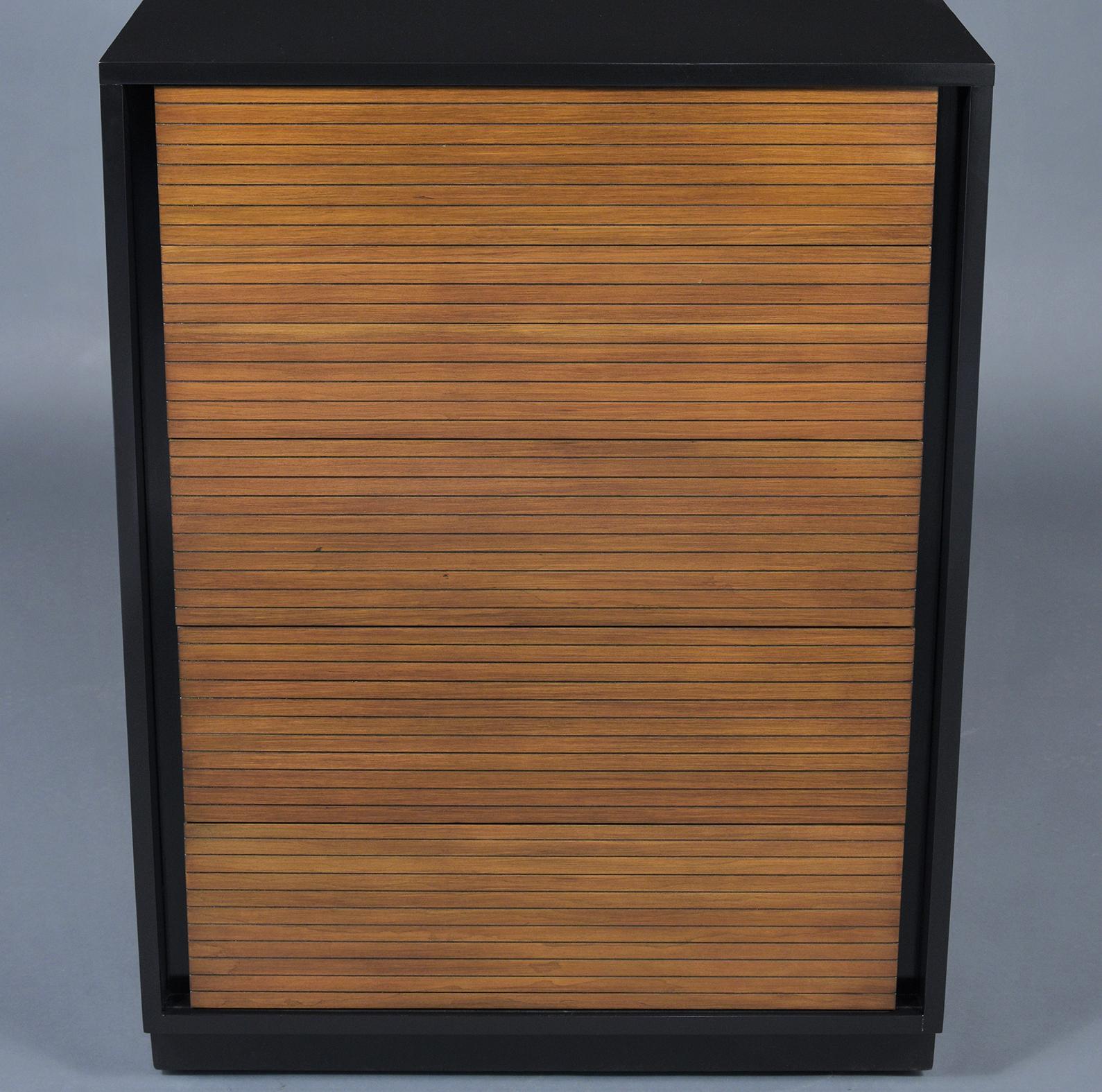 A 1960s mid-century modern walnut chest of drawers handcrafted out of mahogany wood and has been professionally restored by our team of expert craftsmen. This dresser is stained in an ebonized & walnut combination color with a newly lacquered finish