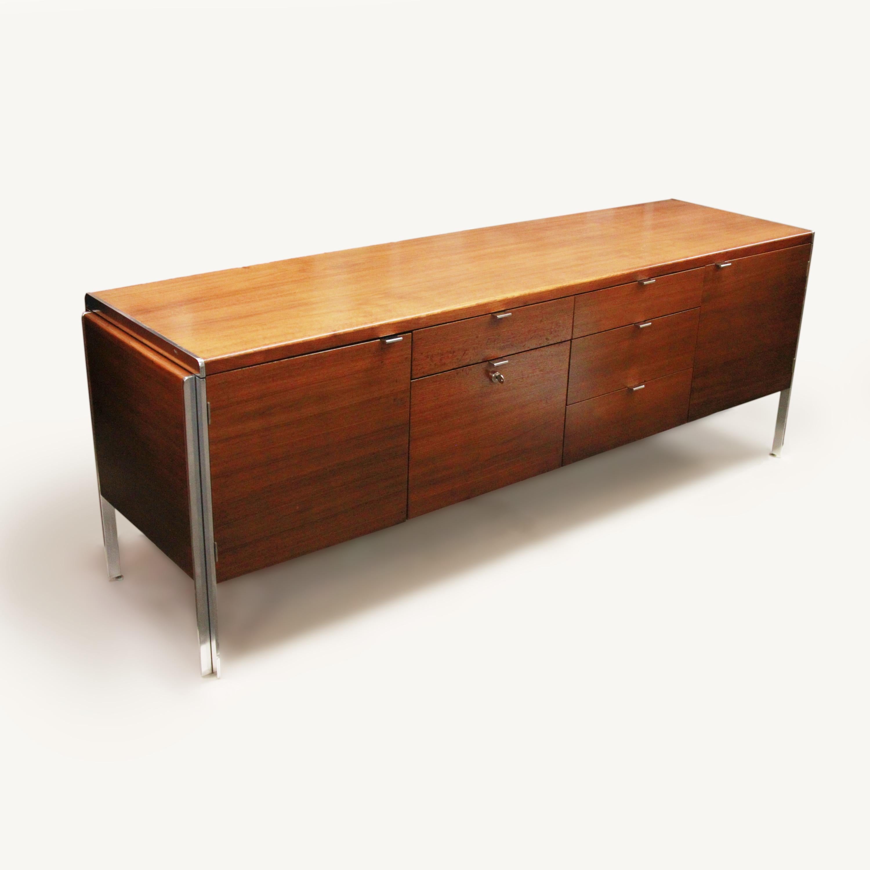 This wonderful Mid-Century Modern credenza by Stow Davis has everything going for it. With its beautifully clean lines by Alexis Yermakov and chrome accents, this credenza is the epitome of 1970s chic. At 74