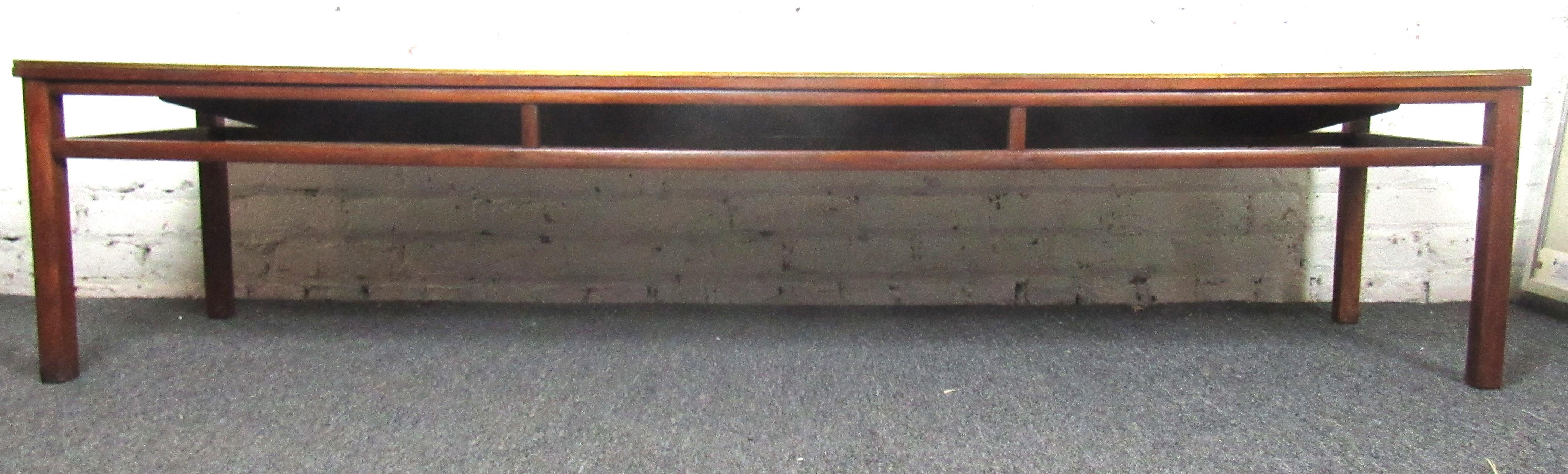 Beautiful vintage modern walnut coffee table/bench with brass trim. This sleek and slender coffee table would make a beautiful addition to any space, and could also double as a bench. Made in Grand Rapids, Michigan by Imperial Furniture