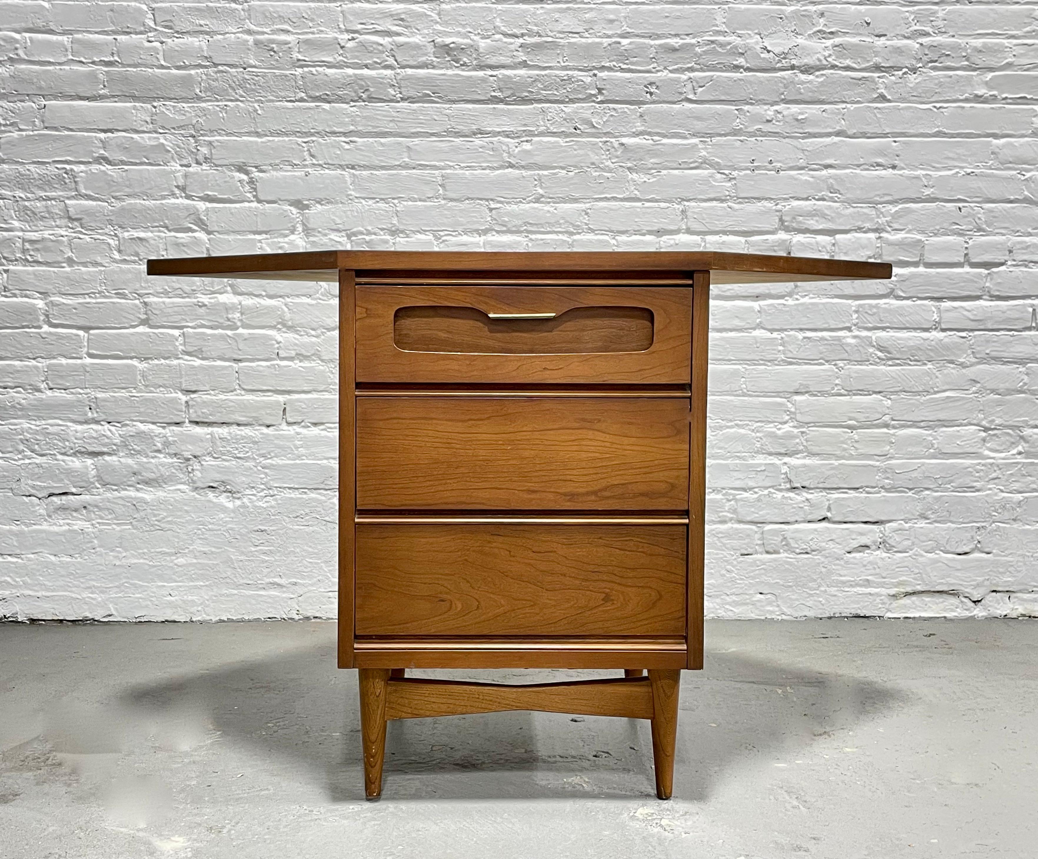 Mid-Century Modern Corner Dresser / Cabinet by Bassett Furniture Co., circa 1960s. This thoughtful piece takes up minimal floor space as it fits neatly into a corner yet provides three deep and spacious drawers for storage. Place in your entryway as