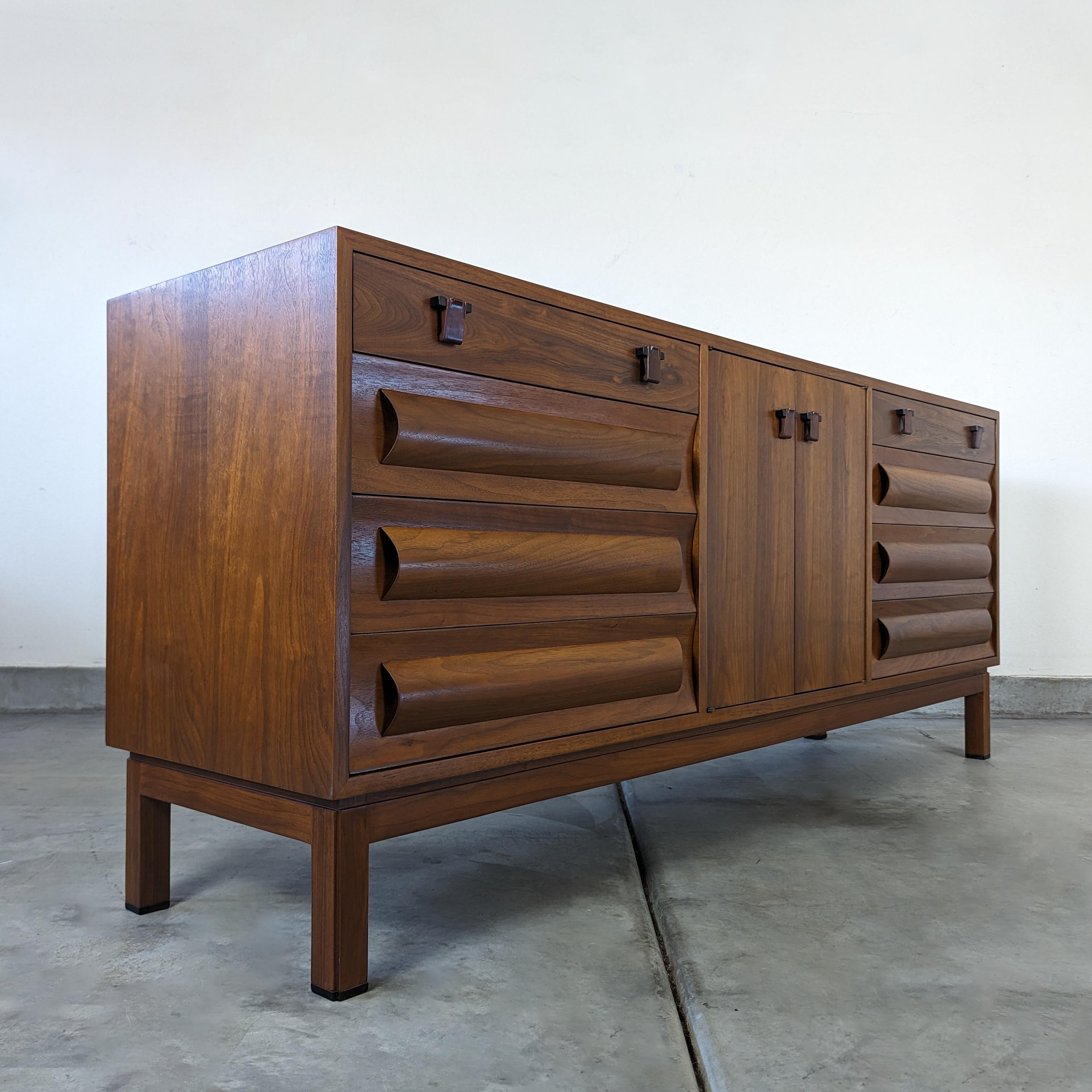 Delve into the world of timeless elegance and sleek craftsmanship with this magnificent Mid-Century Modern credenza designed by renowned designer Edward Wormley for Dunbar. A true gem from the period, this piece exemplifies Wormley's knack for
