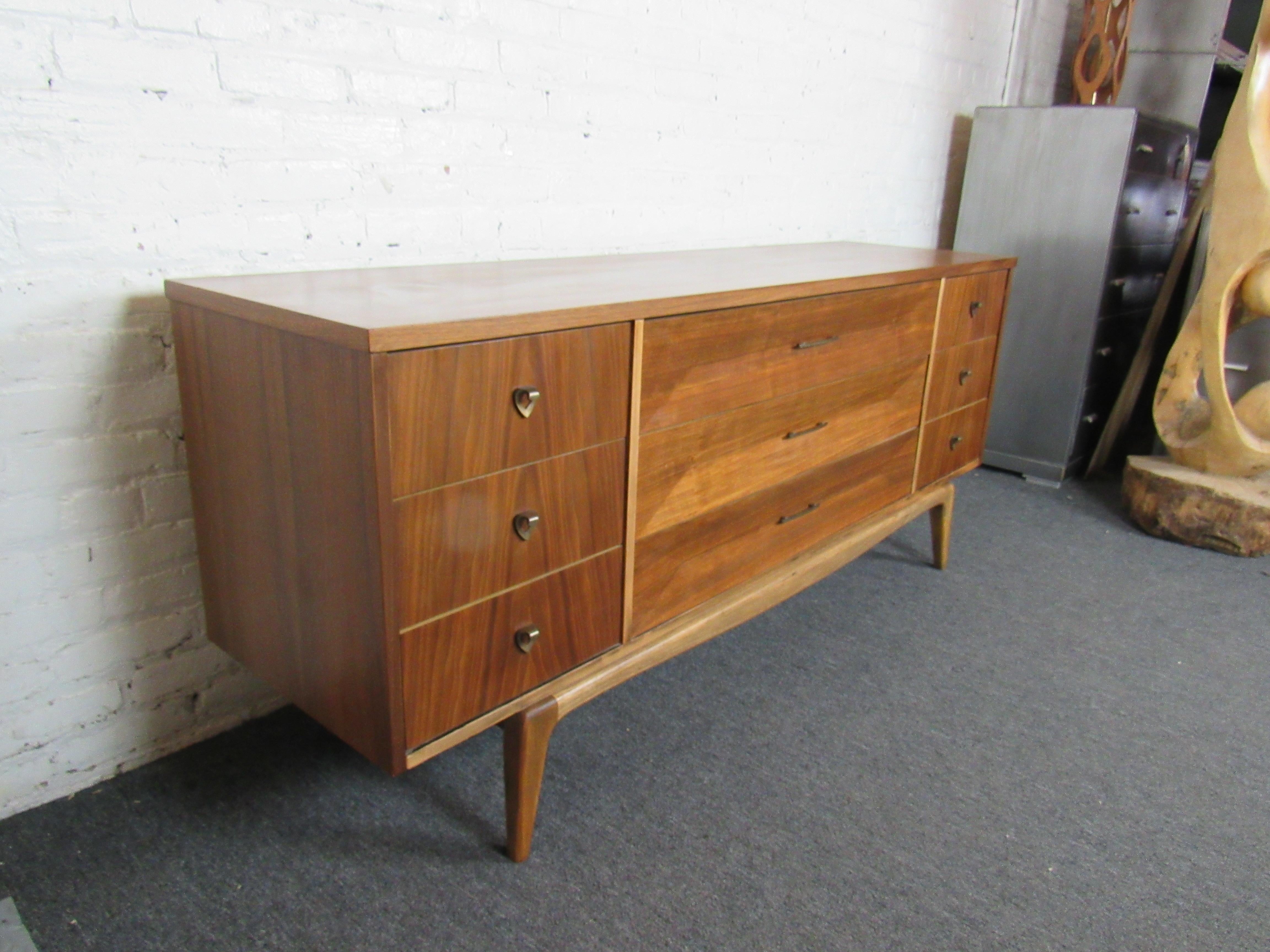 An elegant vintage credenza by United Furniture Corporation, crafted with sturdy mid-century quality and rich walnut. Please confirm item location with seller (NY/NJ).