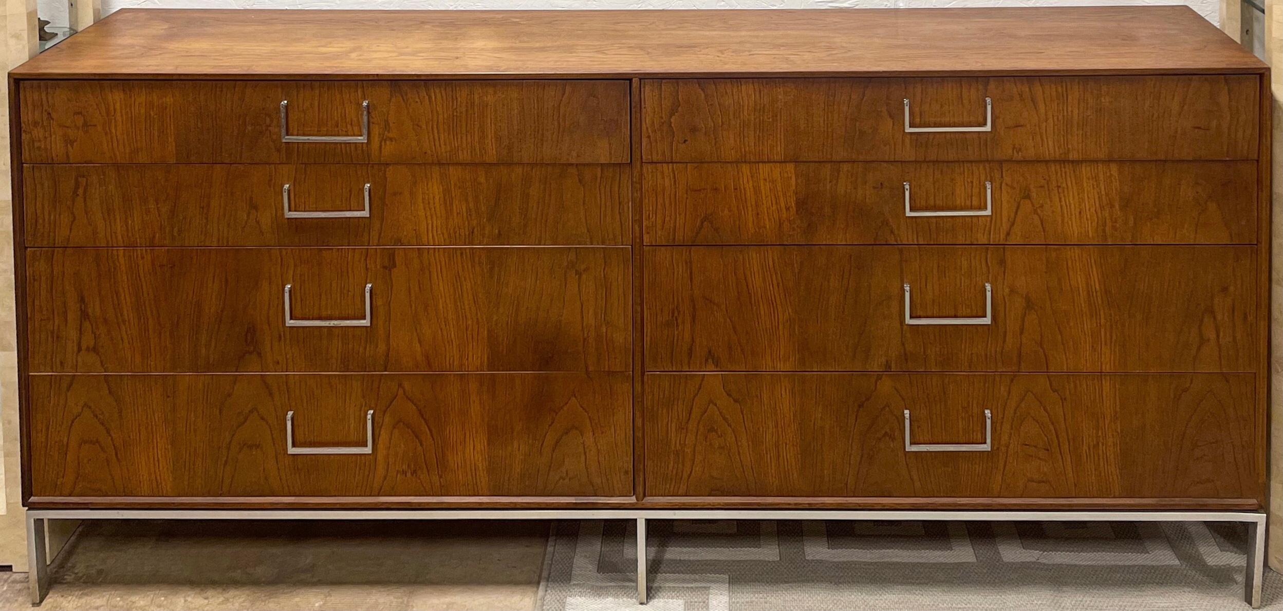 This is a walnut credenza on a chrome base with chrome pulls. It has dovetail construction. This mid-century modern piece is attributed to Florence Knoll. It’s iconic design with it’s clean lines give it timeless modern elegance.