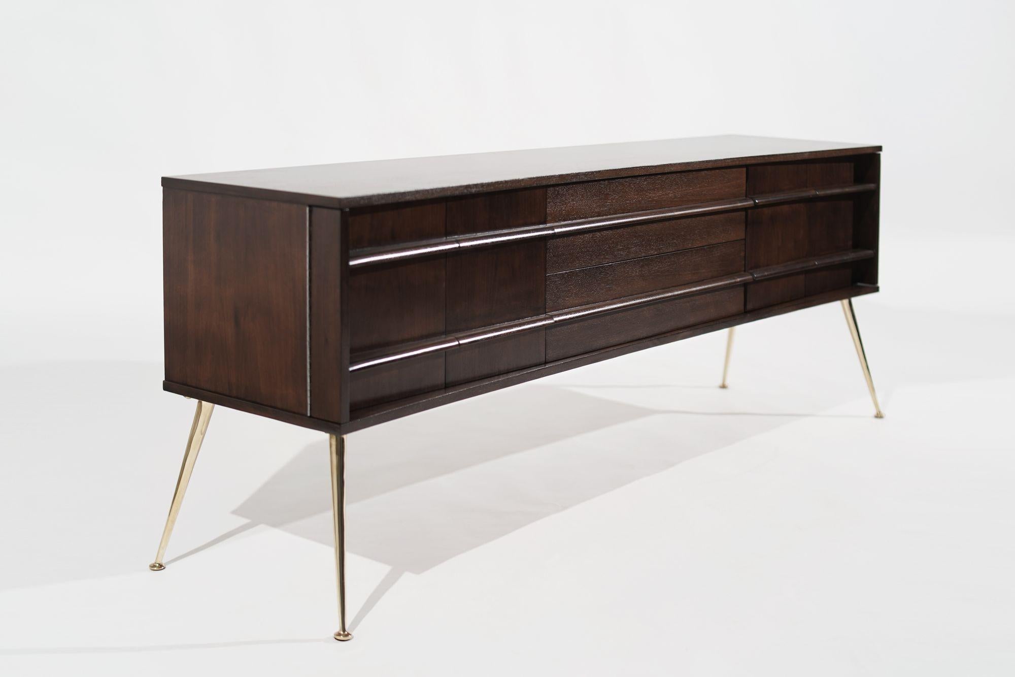 Timeless elegance and mid-century sophistication: A meticulously restored United Furniture Credenza from the 1960s, masterfully revived by Stamford Modern. This exquisite piece showcases the perfect marriage of form and function, boasting a stunning