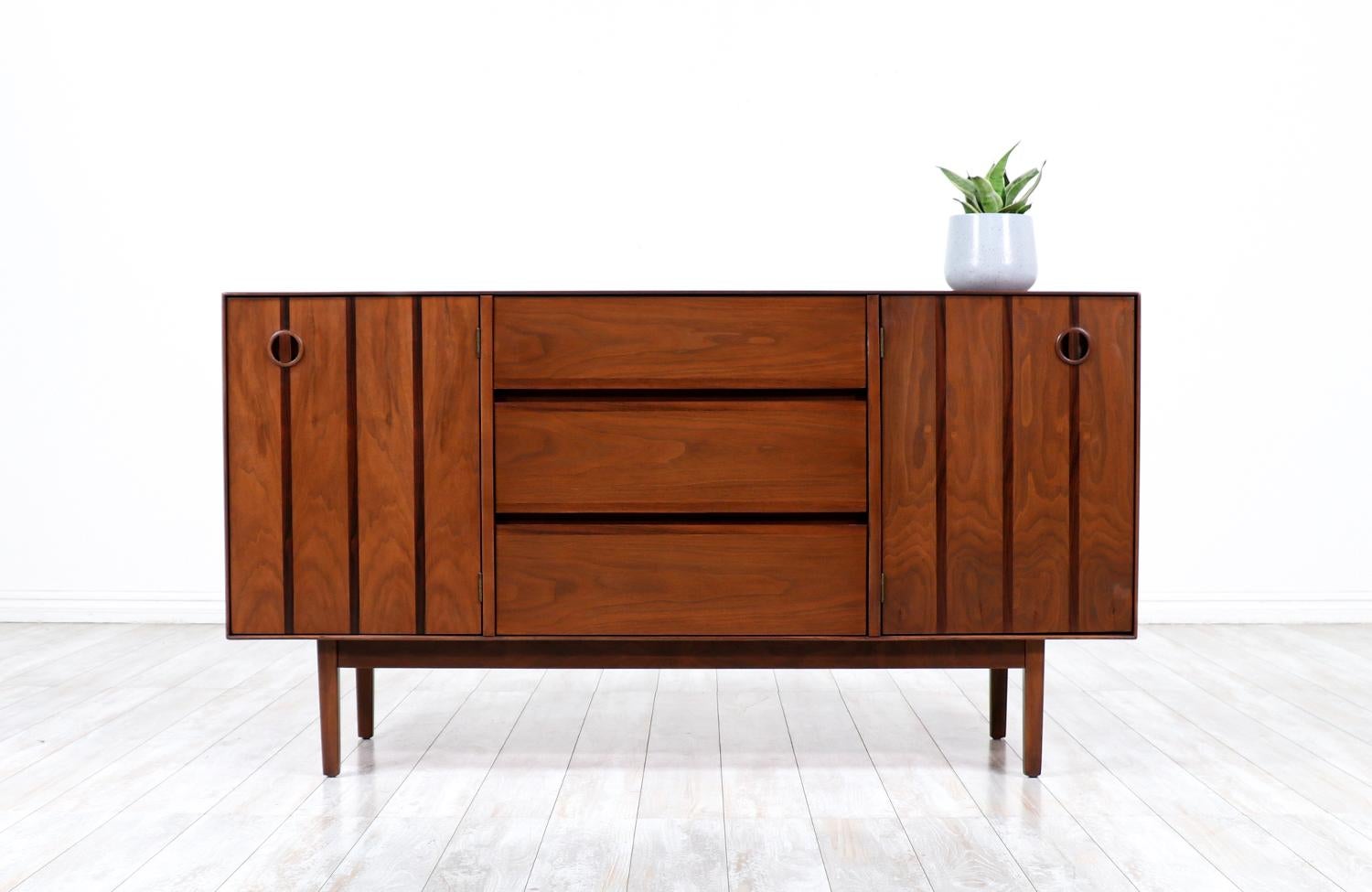 Mid-Century Modern walnut credenza with rosewood inlaid by Stanley Furniture.