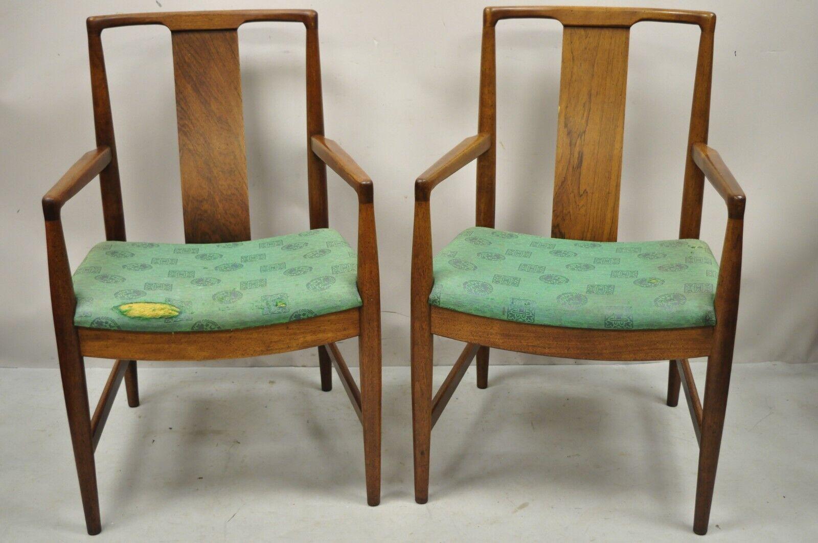 Mid-Century Modern walnut curved angled back dining arm chairs - a pair. Item features sleek curved back rails, angled backrests, beautiful woodgrain, tapered legs, very nice vintage pair. Circa Mid 20th Century. Measurements: 35
