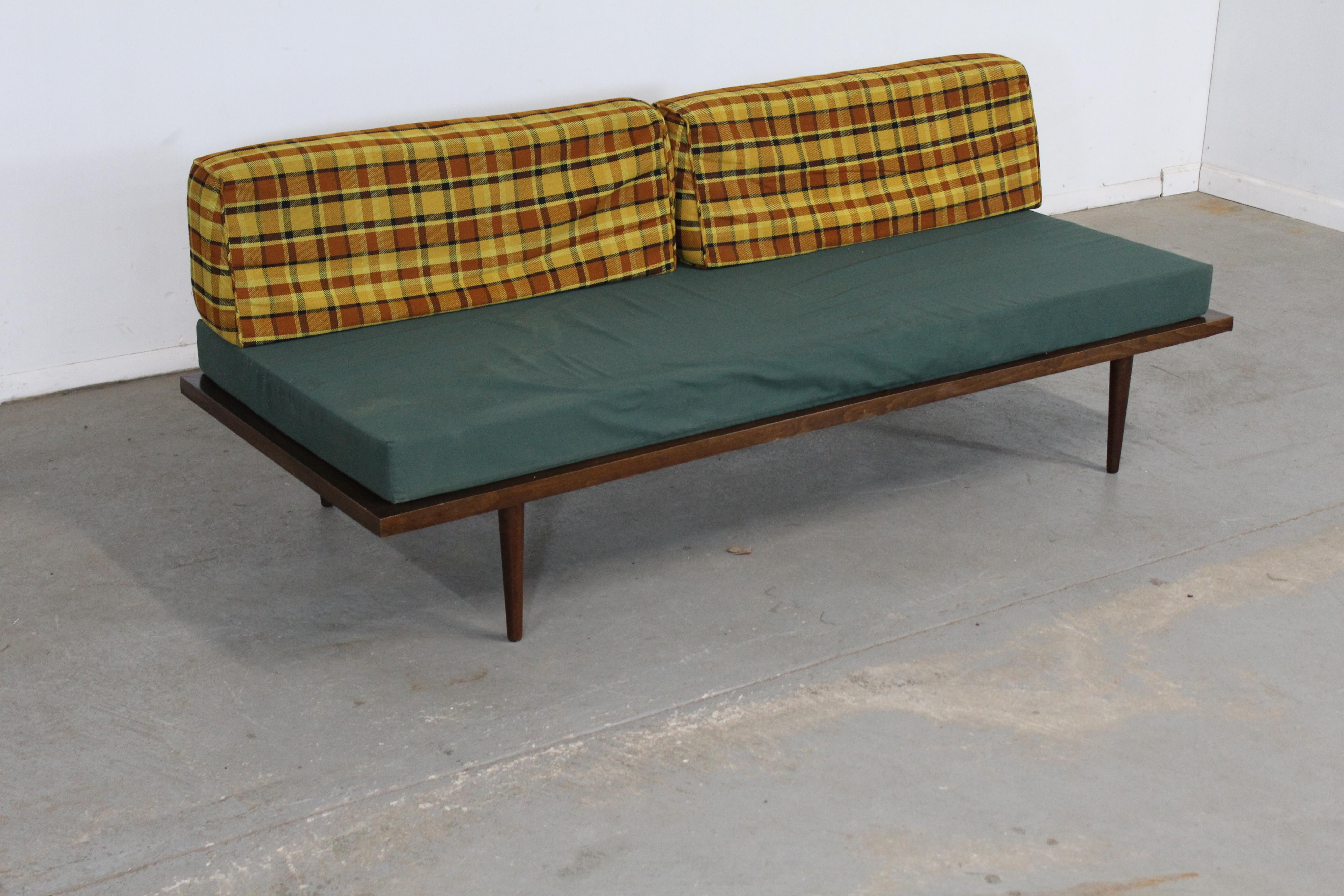 Mid-Century Modern walnut daybed / sofa.

Offered is a Mid-Century Modern walnut daybed / sofa in the style of Adrian Pearsall. The sofa has three removable cushions and is on Pencil legs. It is in great structurally sound condition. It is in good