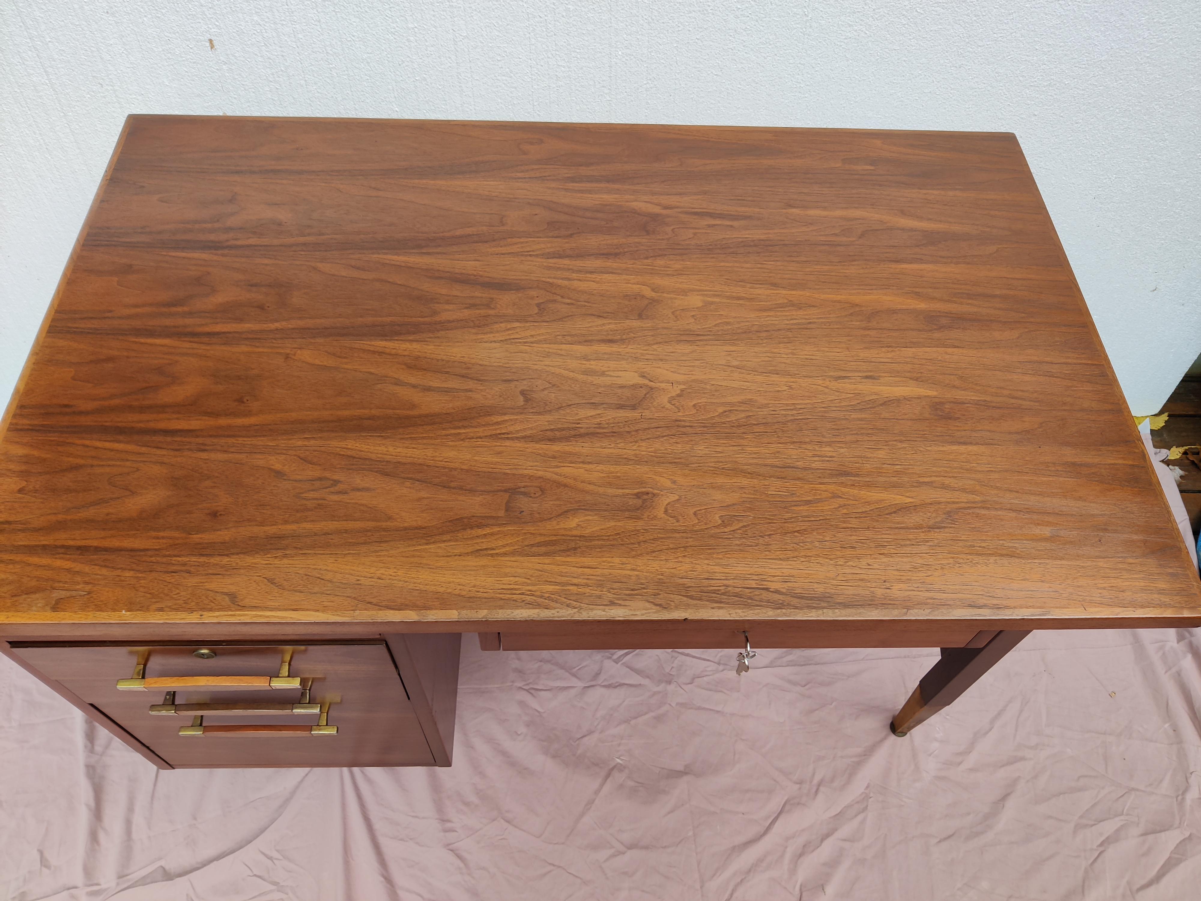 20th Century Mid Century Modern Walnut Desk with brass and walnut pulls For Sale