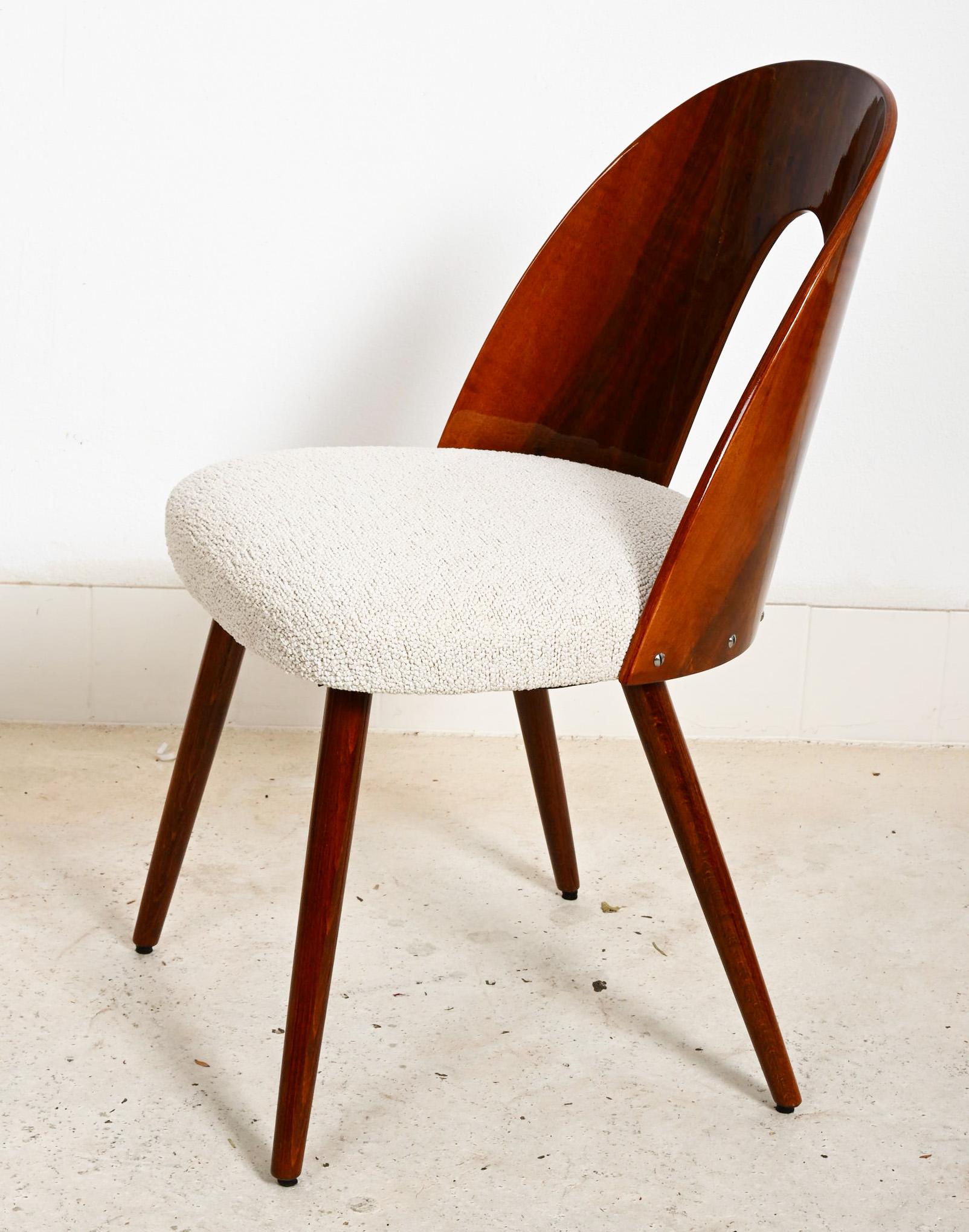 Walnut wood with walnut veneer glossy finish, upholstered with gray/creme bouclé. Designed by Antonin Suman in the 1960s for Tatra in Czechoslovakia. The final upholstery can be customized (upholstery cost incl. but not the fabric cost) 
Up to 24