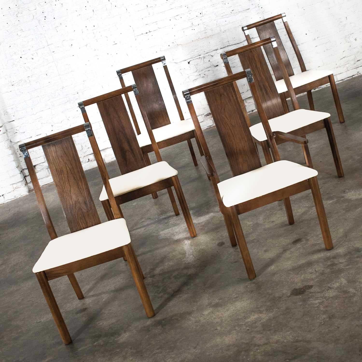 Gorgeous Mid-Century Modern dining chairs set of six 5 side and 1 armchair comprised of walnut veneer and walnut colored stained wood; chrome accents; and new off-white canvas upholstery. Beautiful condition and normal wear as would be expected with