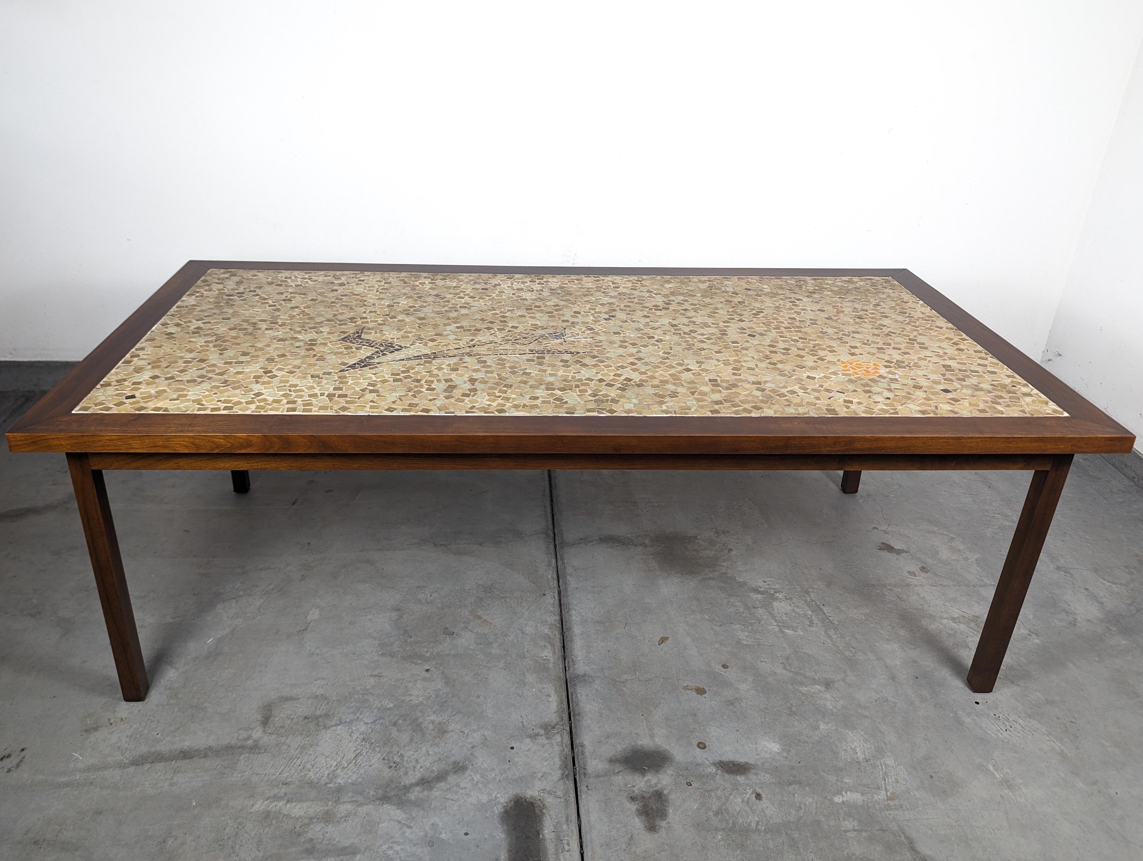 Step into the world of timeless elegance with this exquisite vintage mid-century modern walnut dining table, a true testament to the design prowess of the 1970s. Attributed to the renowned craftsmanship of Brown Saltman, this stunning piece boasts a