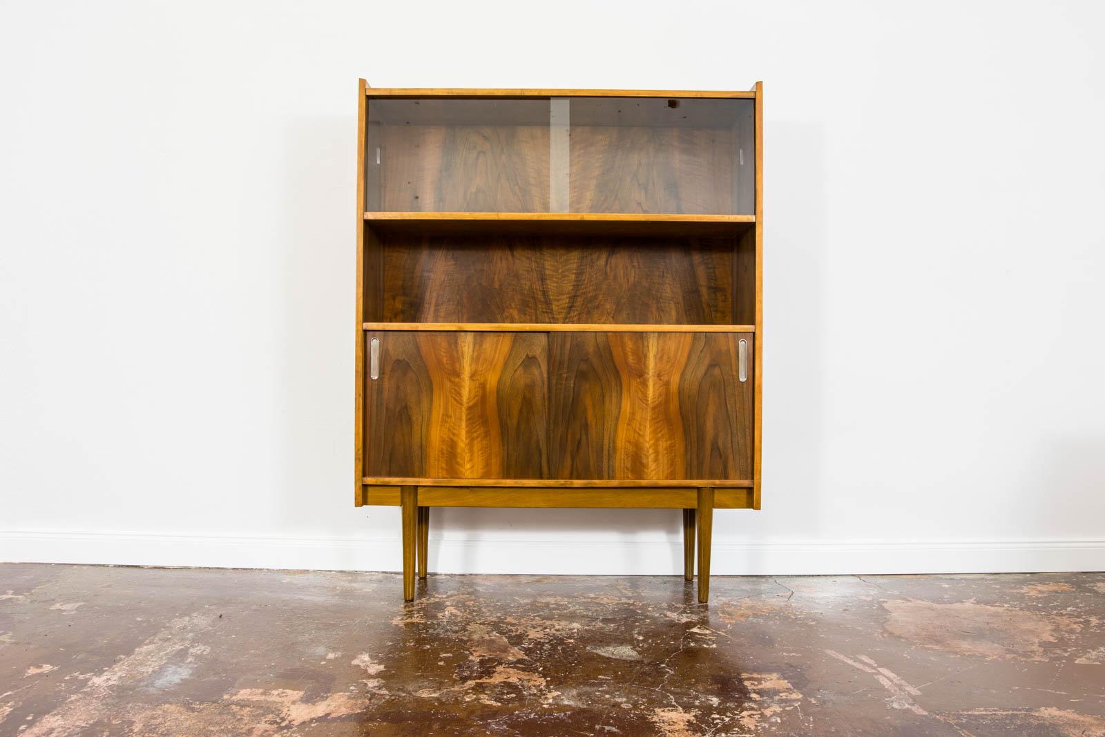 Mid Century Modern Walnut Display Cabinet 1960's by Bytomskie Furniture Factories in 1960's.
Item has been restored and refinished enhancing unique grain hue and pattern of walnut veneer.