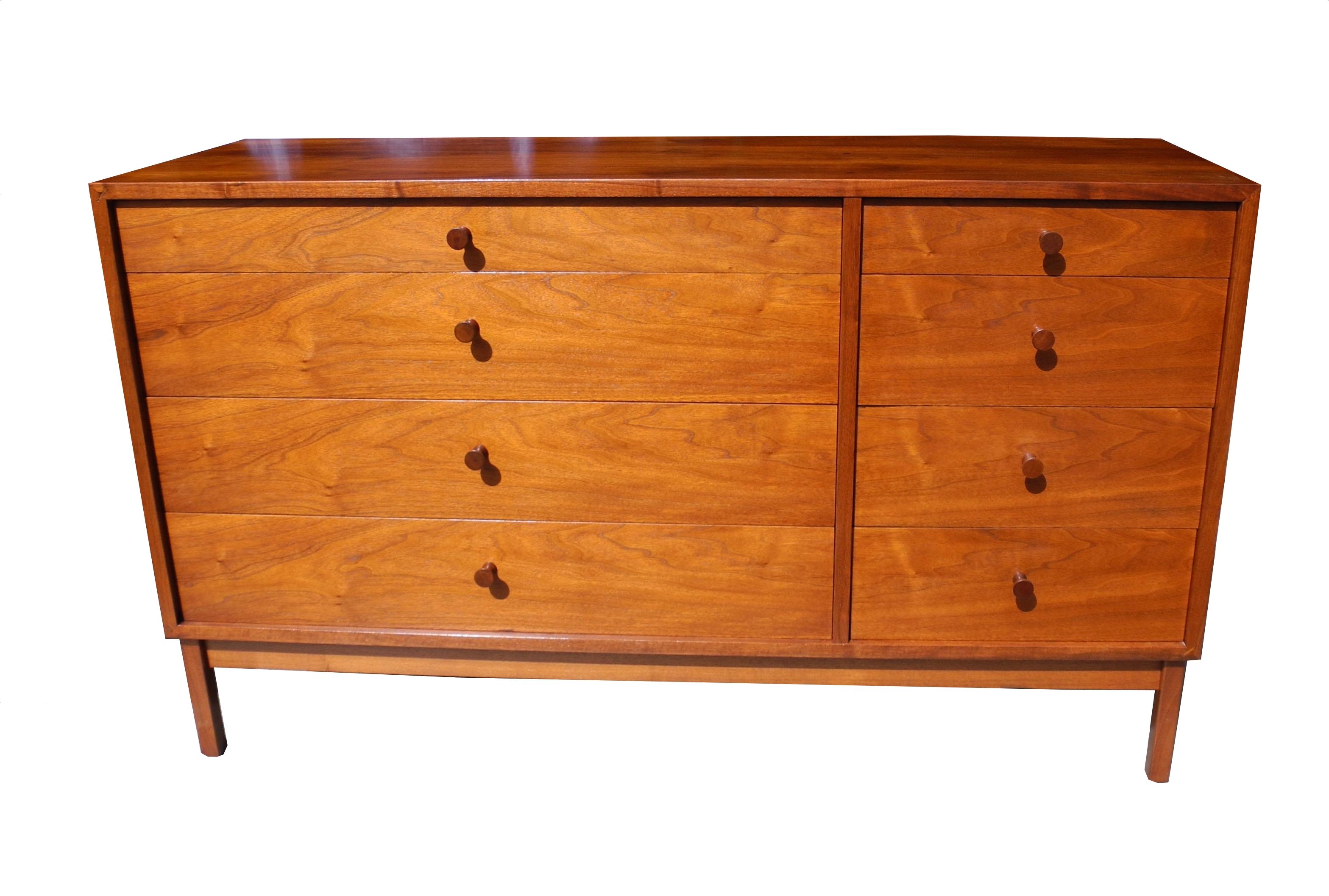 This beautiful Mid-Century Modern walnut dresser has two banks of drawers. One wider and one smaller. Made in the 1950s by artist Richard Artschwager before his notoriety for his art. He made furniture to support himself as a young artist.
 