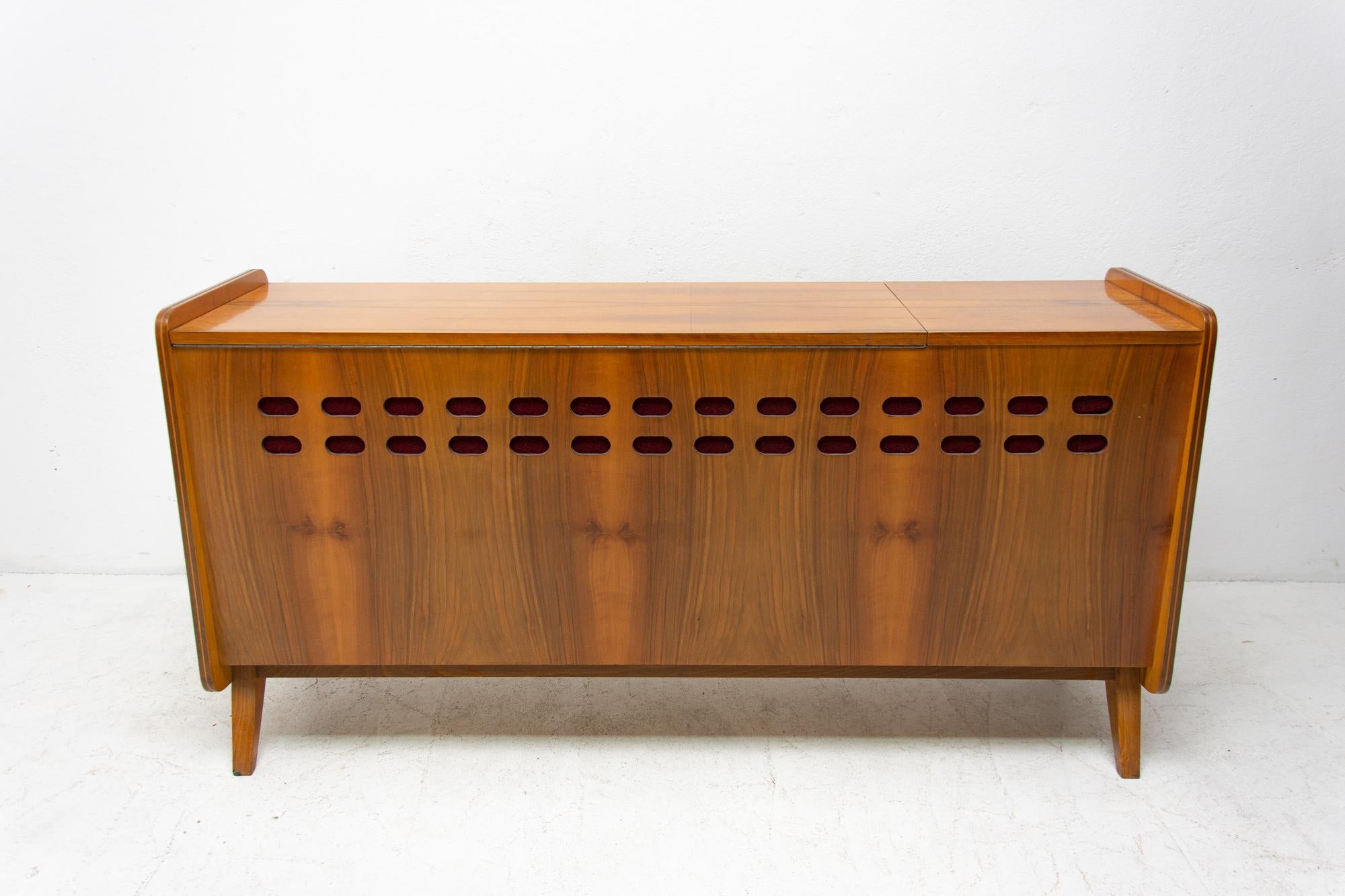 Mid-Century Modern walnut dresser by Frantisek Jirak for Tatra nabytok. Made in the former Czechoslovakia during the 1960s. The dresser is a part of living set. The furniture is primarily intended as a chest of drawers, but it can also be used as a