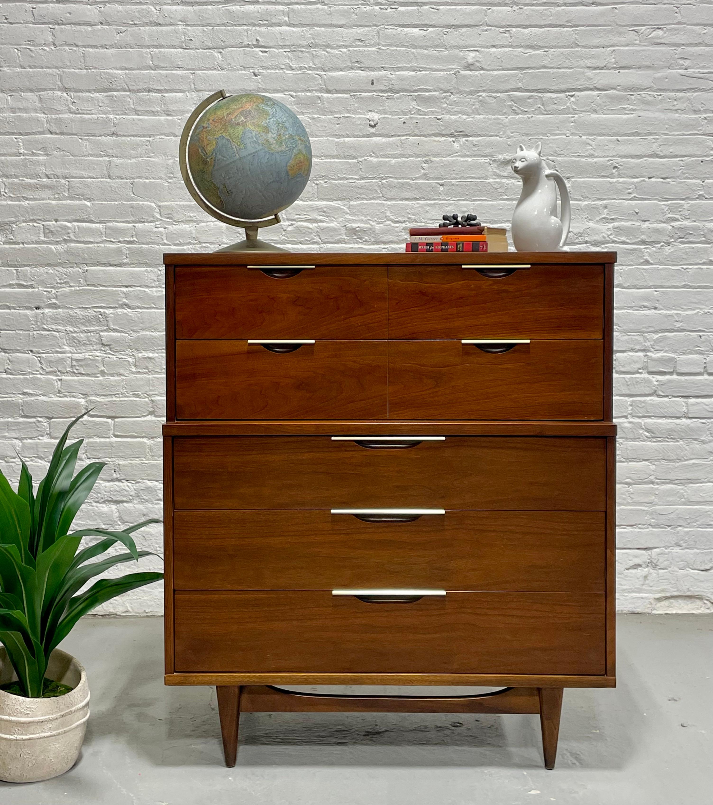 Mid Century Modern Walnut Dresser / Highboy by Kent Coffey's Tableau Line, circa 1960's. This lovely piece features five deep and spacious drawers for plenty of storage space. This piece will be a work horse in your bedroom, storing bulkier items