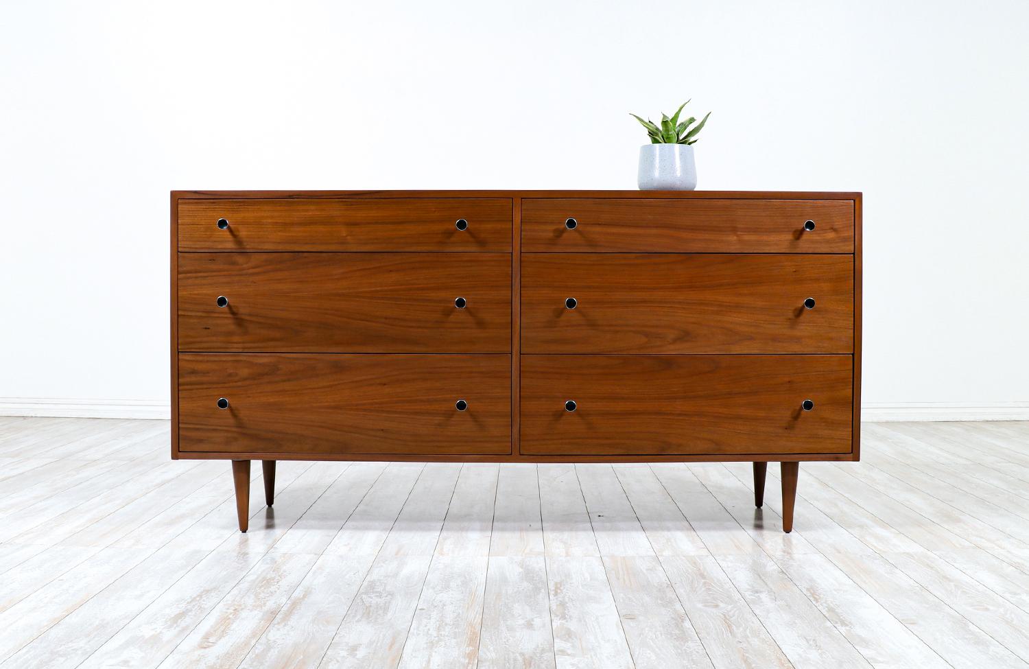 Mid-century modern dresser designed by Kipp Stewart and Stewart MacDougall for Glenn of California in the United States circa 1950s. Newly refinished by our expert craftsmen, this spectacular six-drawer dresser features dovetailed construction and a