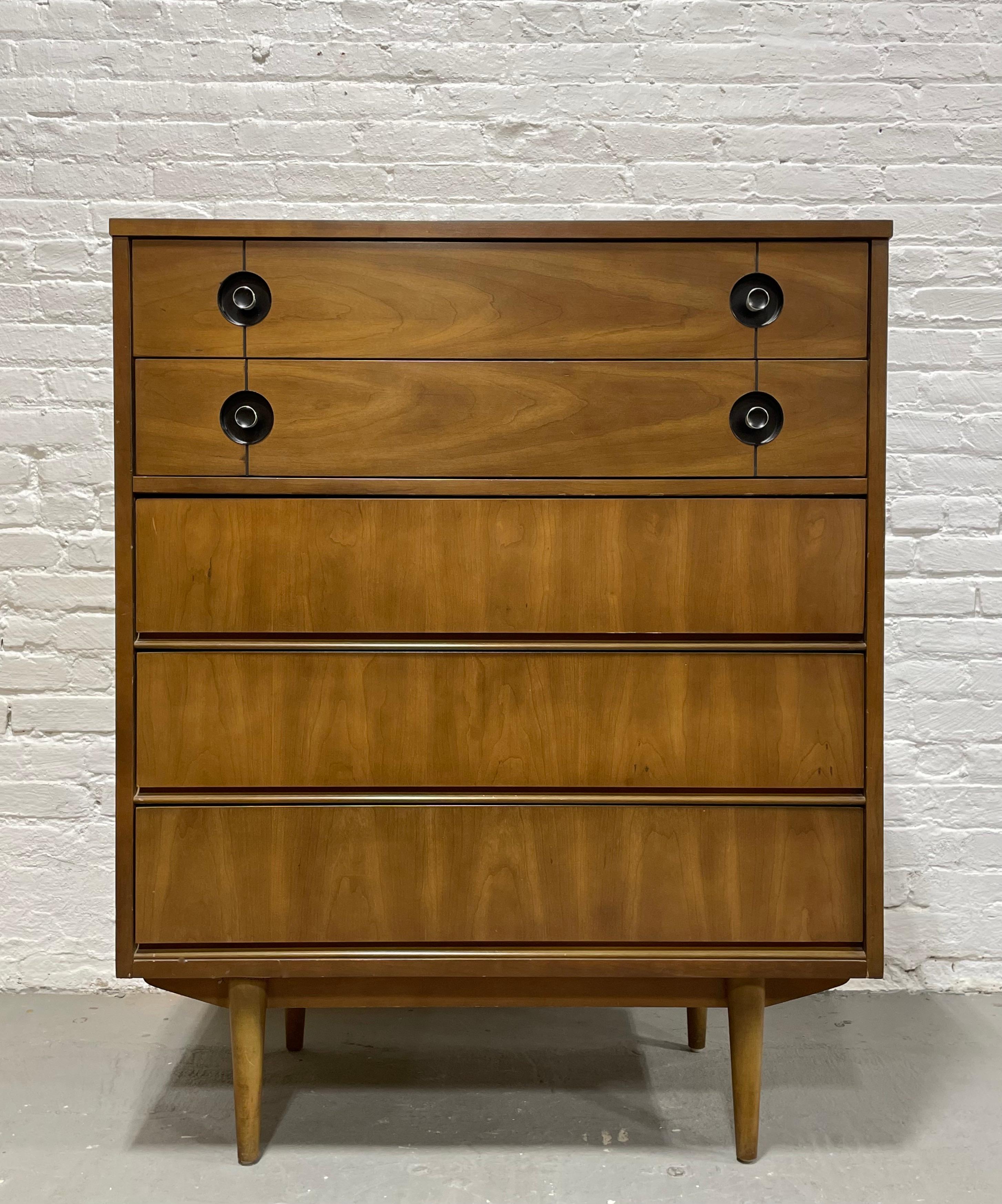 Mid Century Modern Walnut Dresser by Stanley Furniture Co., c. 1960's. This solid dresser offers a ton of storage space over five spacious drawers.  Gorgeous woodgrains throughout with a unique recessed ebonized chrome drawer pull design.