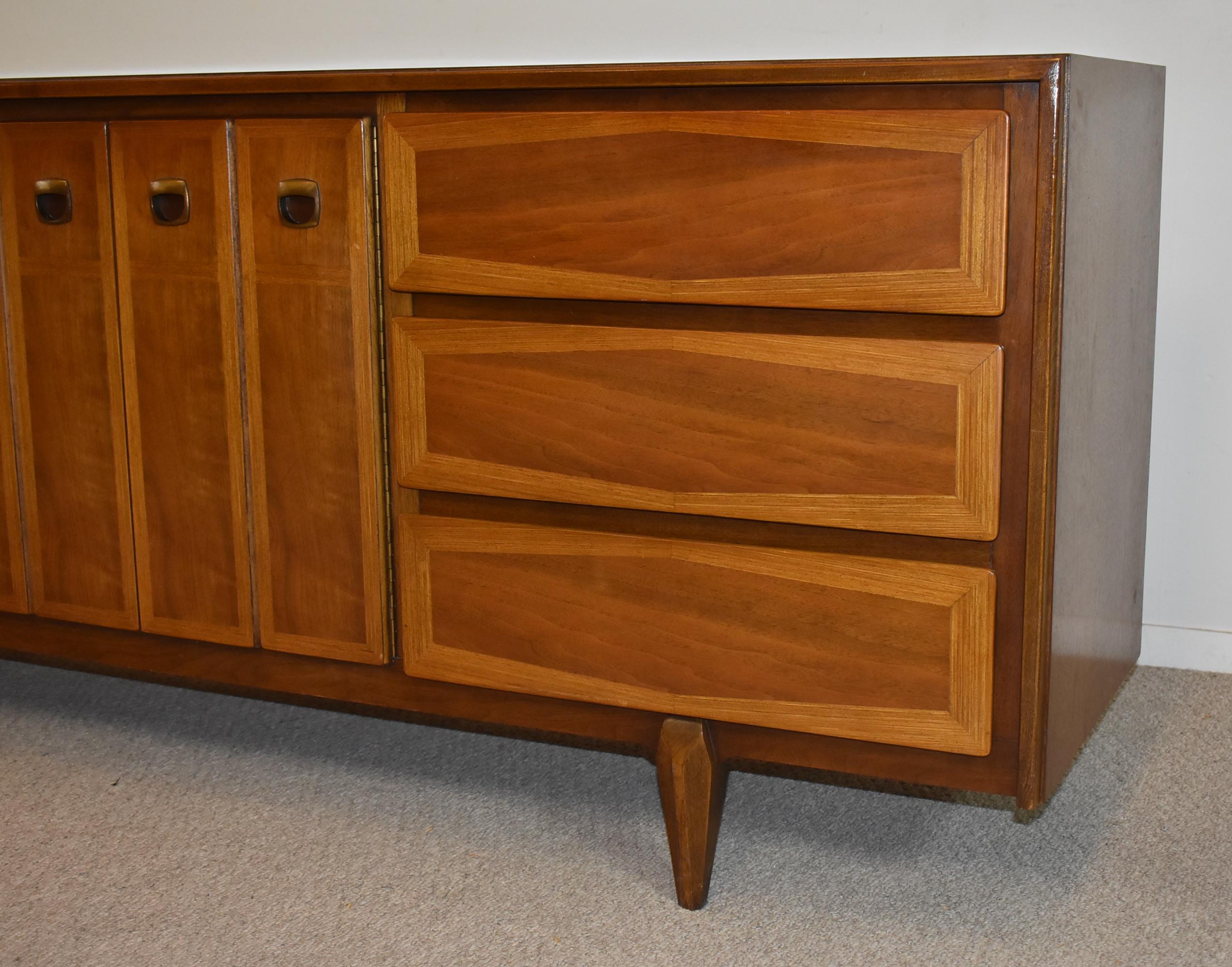Walnut mid-century modern dresser credenza by American of Martinsville. 6 drawers, 2 center doors with 3 drawers inside. Part of a 4-piece set. Great condition. 74
