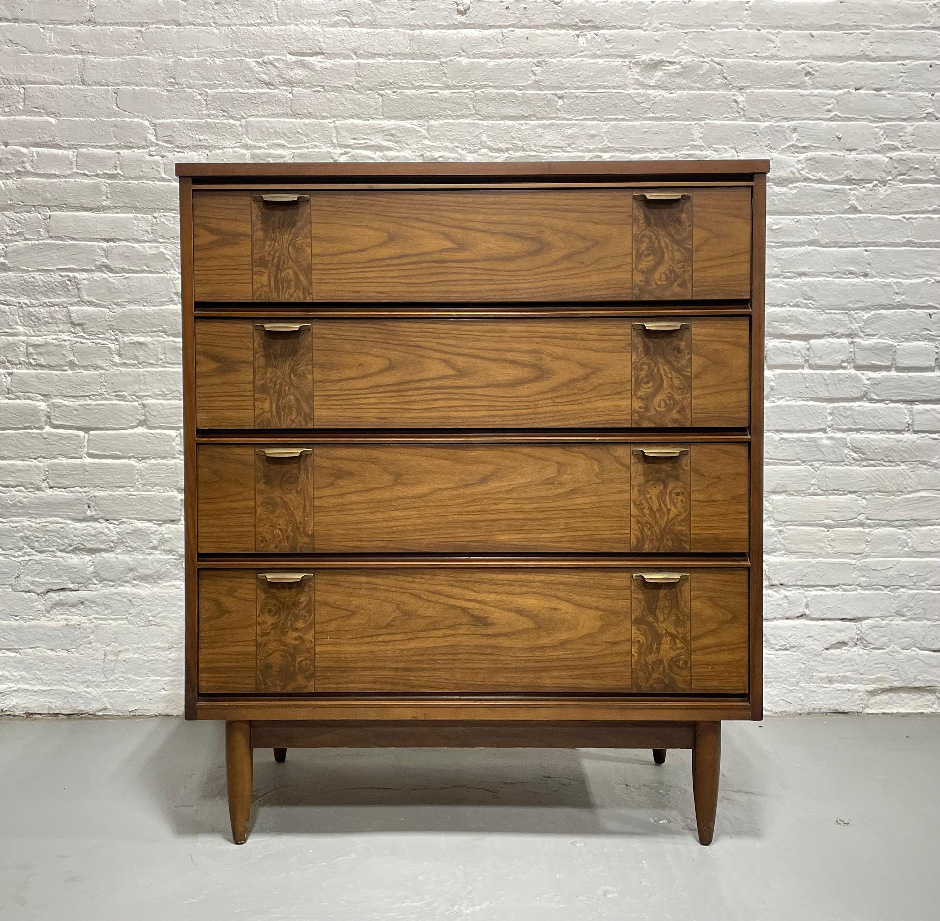 Mid Century Modern Walnut Dresser / Highboy, c. 1960's. This solid dresser offers a ton of storage space over four deep and spacious drawers.  Lovely woodgrains with decorative detailing along each drawer.  Nice vintage condition with some light