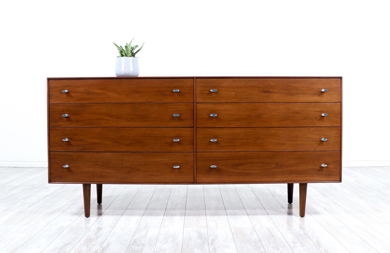 Mid-Century Modern walnut dresser with chrome pulls by R-Way Furniture.
