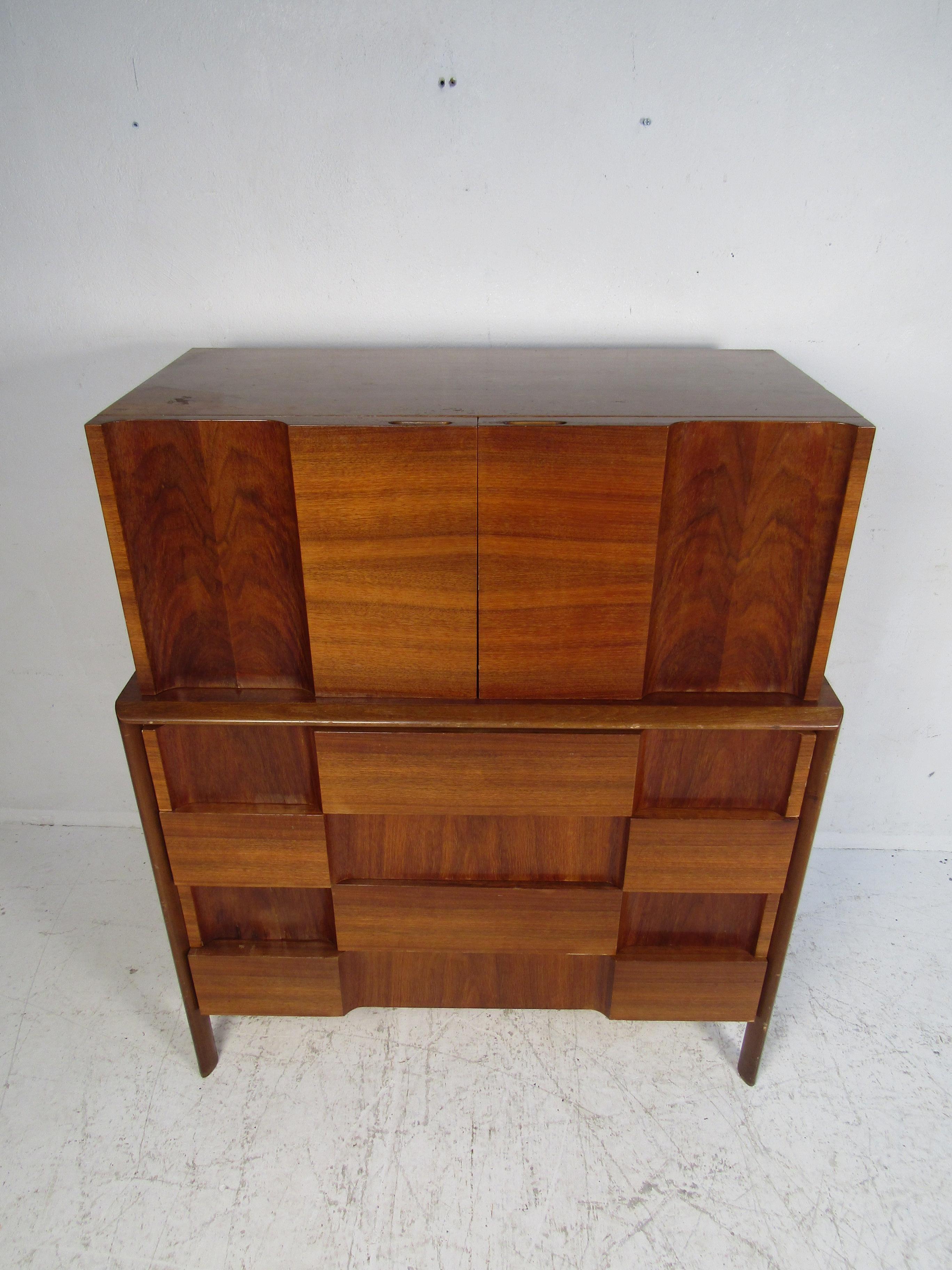 This stunning vintage modern bedroom set by Edmond Spence features the iconic checkerboard front. This set includes two nightstands, a low dresser, and a highboy dresser. An unusual design that offers plenty of room for storage within its many