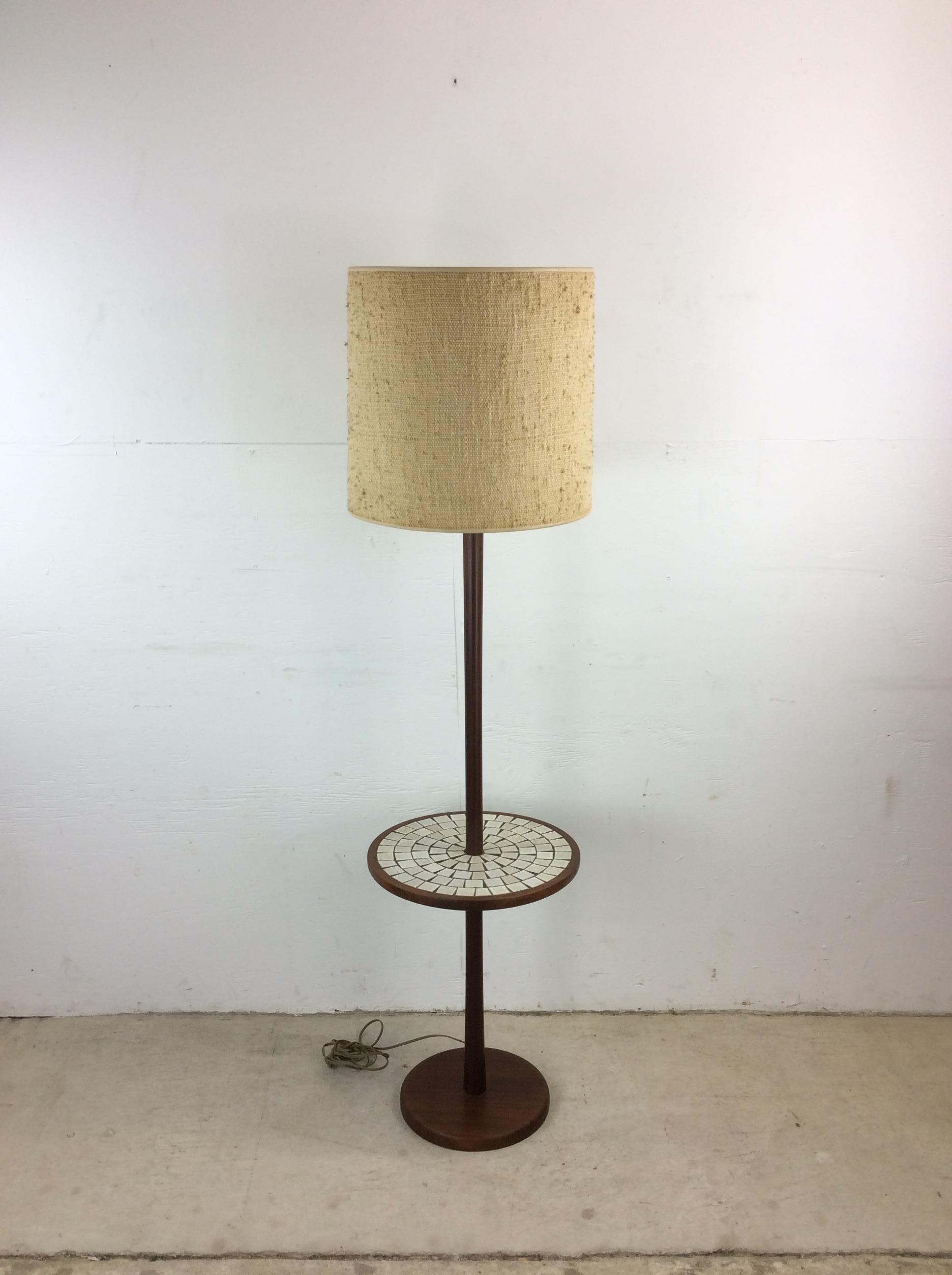 This mid century modern floor lamp features solid walnut construction, built-in round table with mosaic tile, vintage barrel shade, and solid wood finial. 

Dimensions: 15w 15d 60h

Condition: Original finish is in excellent condition. There are