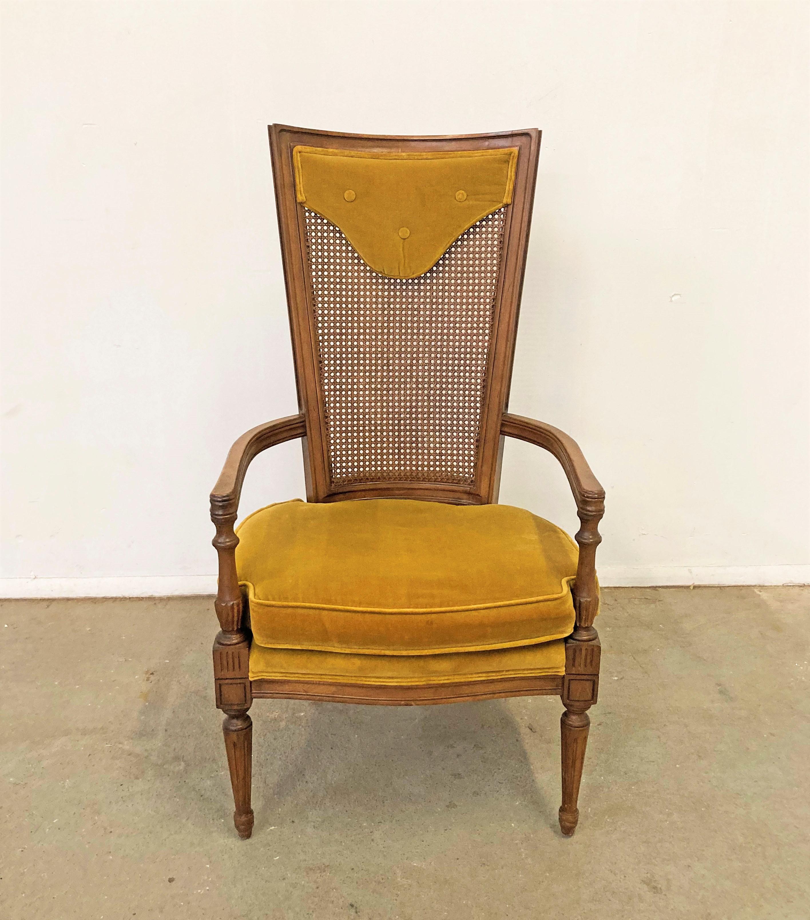 Mid-Century Modern high back cane dining chair

Offered is an unusual shaped high back cane chair. This piece has original velvet upholstery that is in good vintage condition with minor fading. The chair structure has some scratching and
