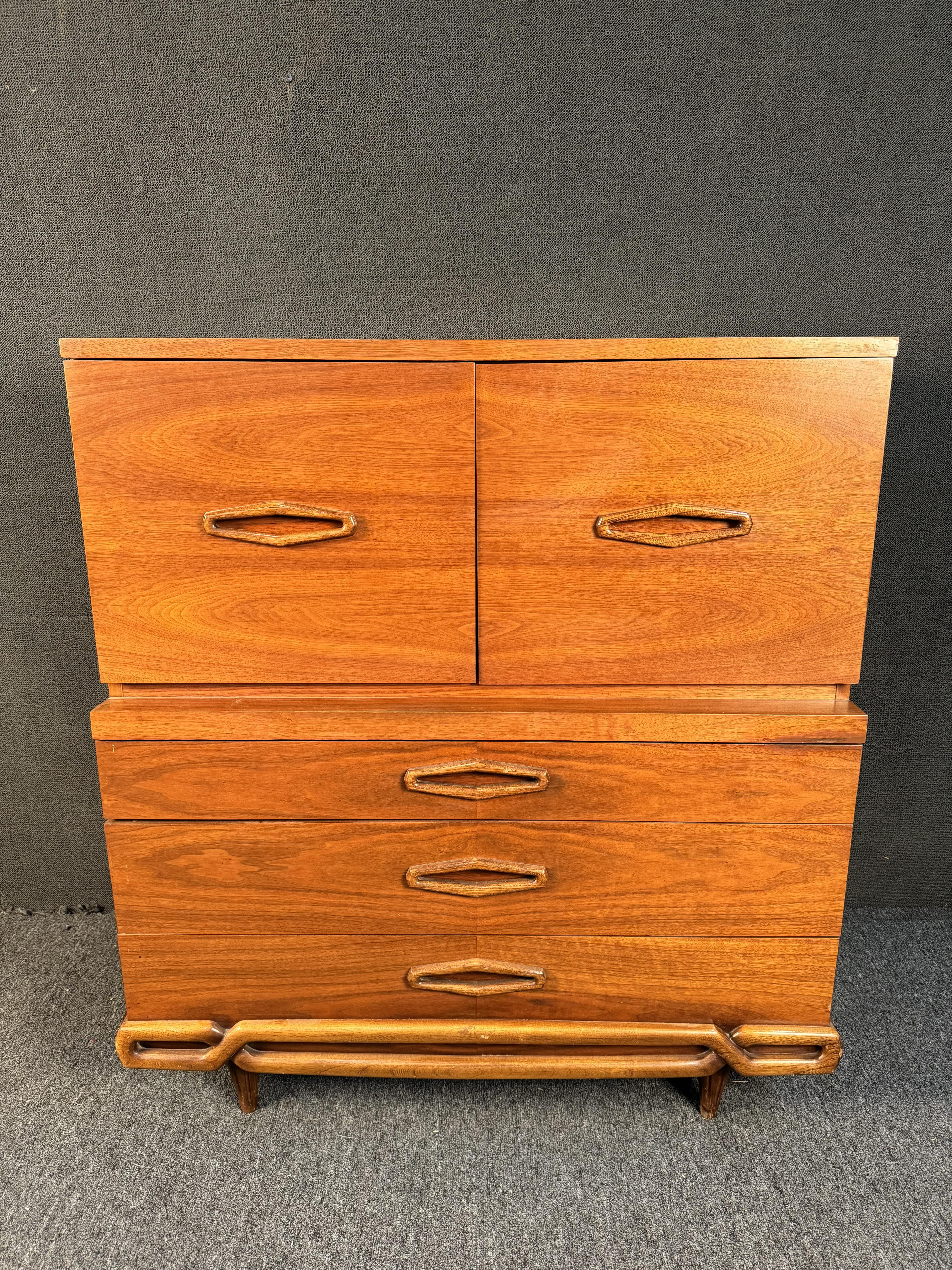 Stunning Mid-Century Modern Walnut High Dresser. Featuring beautiful protruding diamond shaped pulls, five spacious drawers, and tapered legs. Please confirm location with dealer (NY or NJ)