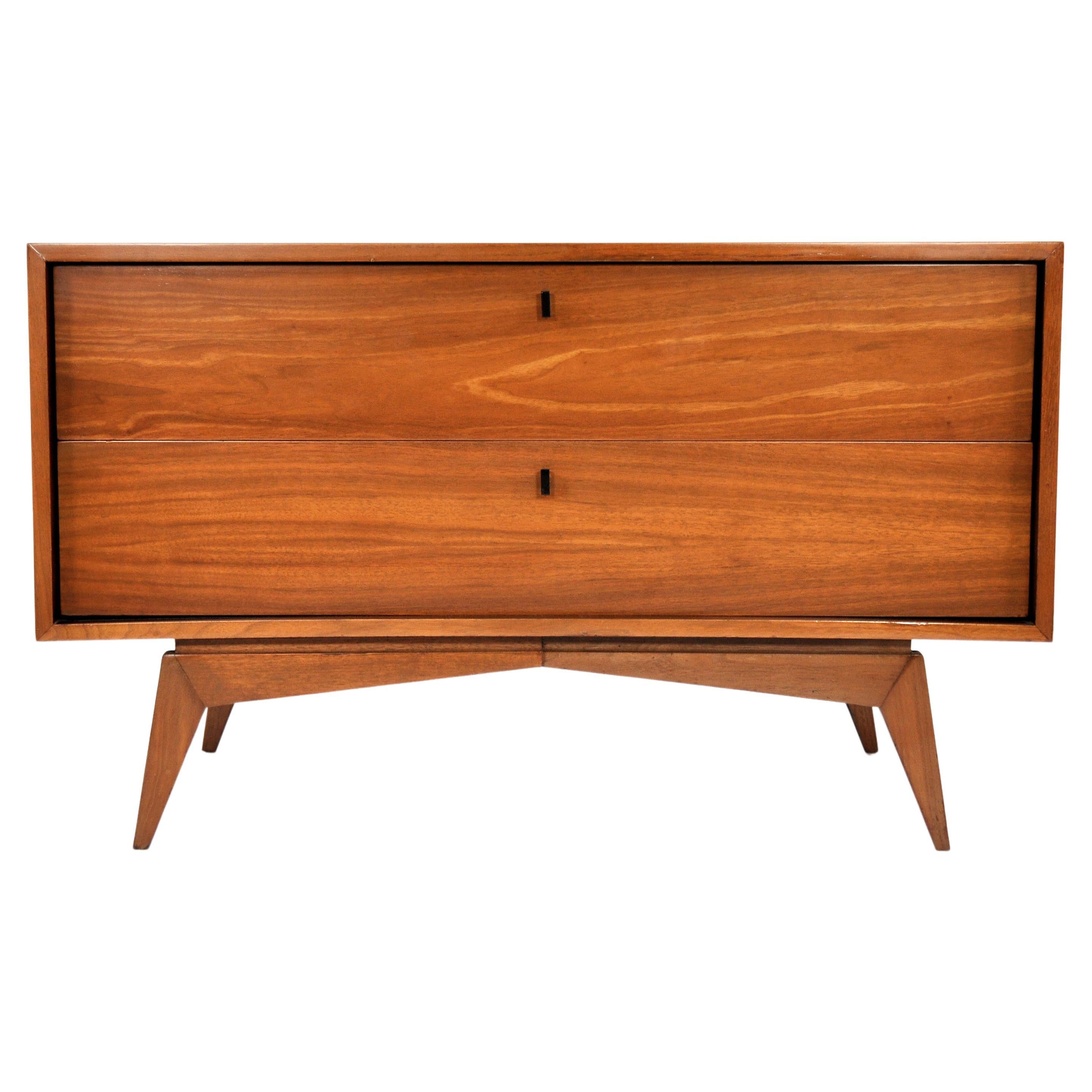A striking vintage Mid-Century Modern walnut chest of drawers dating from the late 1950s to early 1960s. The sculptural bachelor or gentleman's chest's removable top piece features two doors with sculpted fronts opening to an interior fitted with