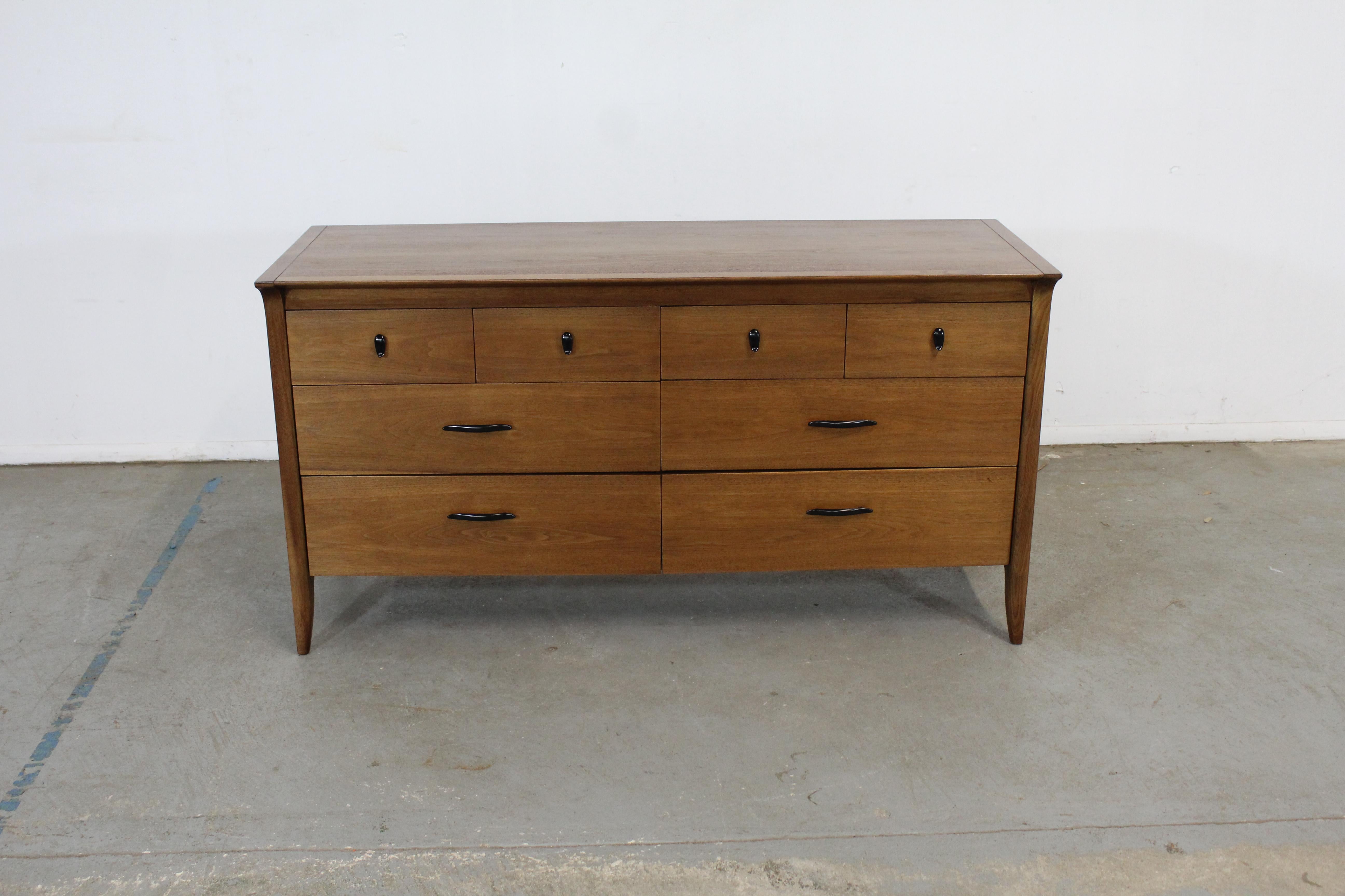 Mid-Century Modern walnut John Van Koert credenza/dresser


Offered is a beautiful Mid-Century Modern walnut John Van Koert tall chest with ample storage space, which was manufactured by Drexel. Features 8 drawers. It has been refinished and is
