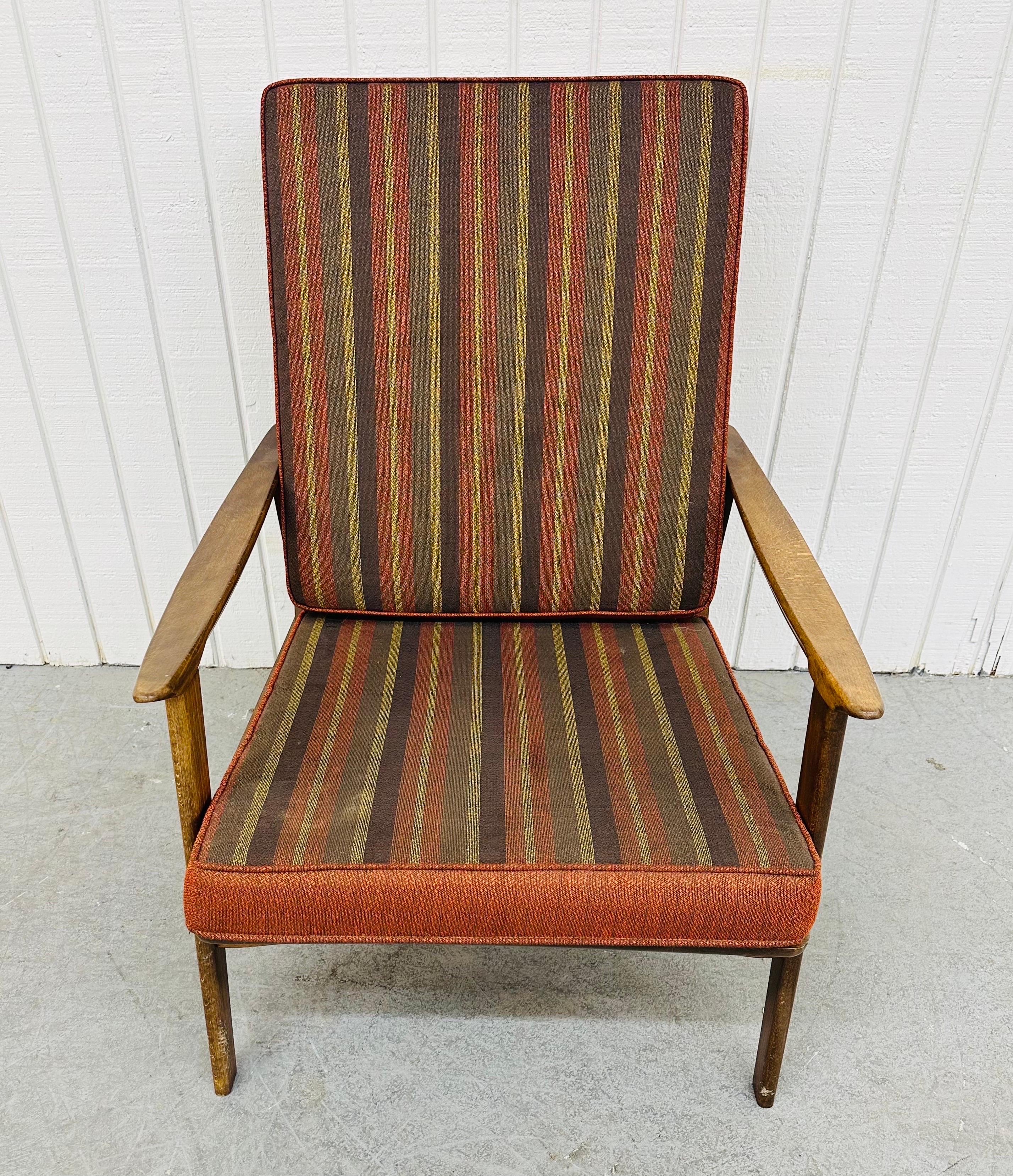 This listing is for a Mid-Century Modern Walnut Lounge Chair. Featuring a straight line walnut designed chair frame, original removable cushions, curved arms, and a beautiful walnut finish. This is an exceptional combination of quality and design!