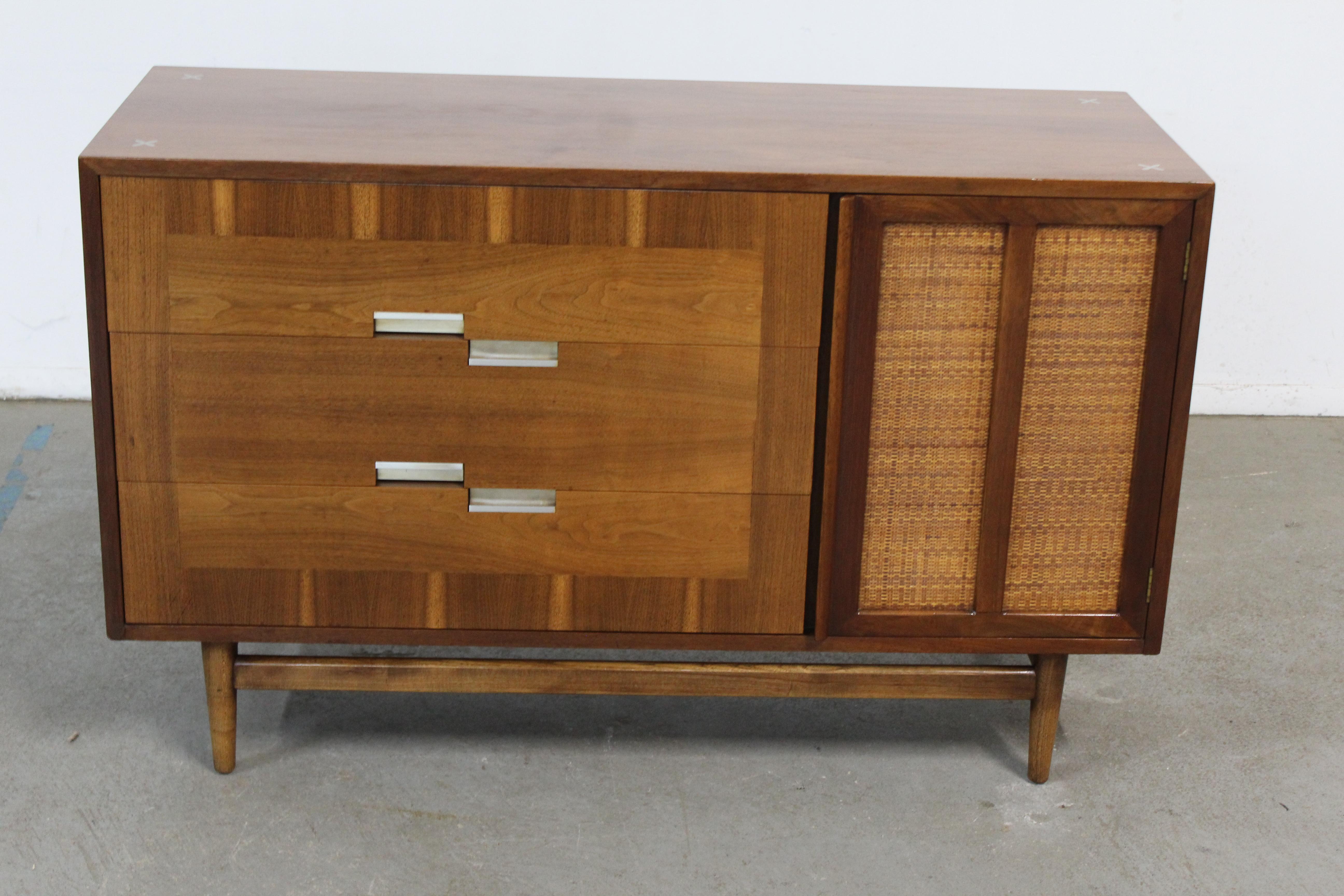 Mid-Century Modern walnut mini sideboard/credenza by American of Martinsville 

Offered is a Mid-Century Danish Modern American of Martinsville walnut credenza. This piece has the look. This is a walnut cabinet with a caned door and 3 drawers. It