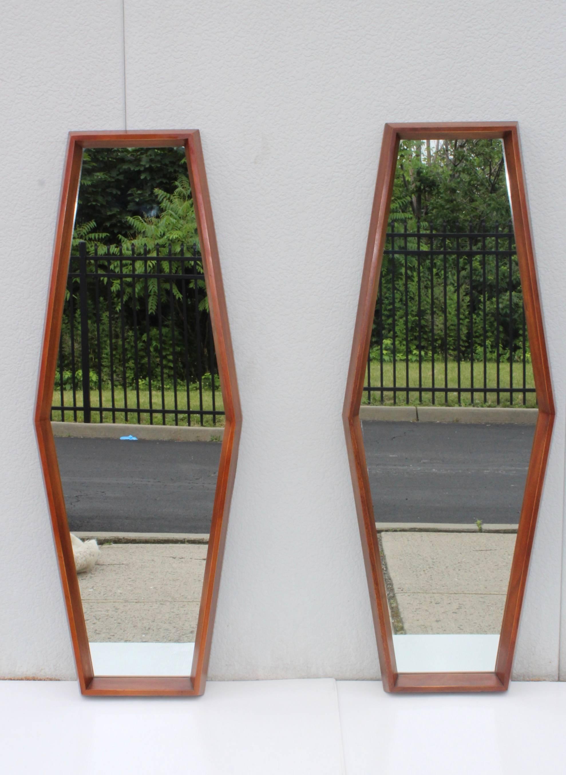 Stunning pair of large 1960s diamond shape solid walnut wall mirrors.