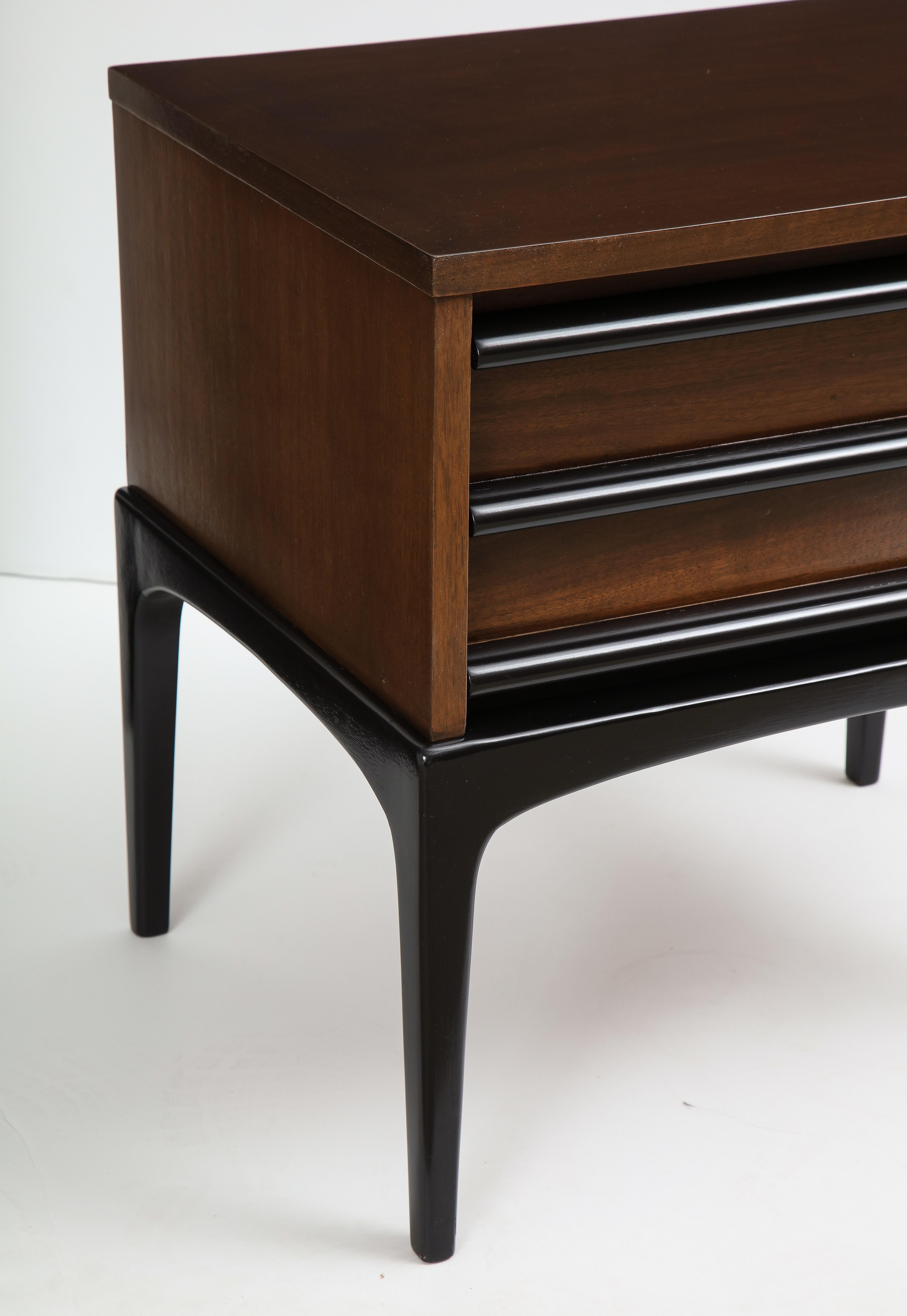 Pair of modernist Walnut nightstands with contrasting ebonized legs and drawer pulls. Mint restored.