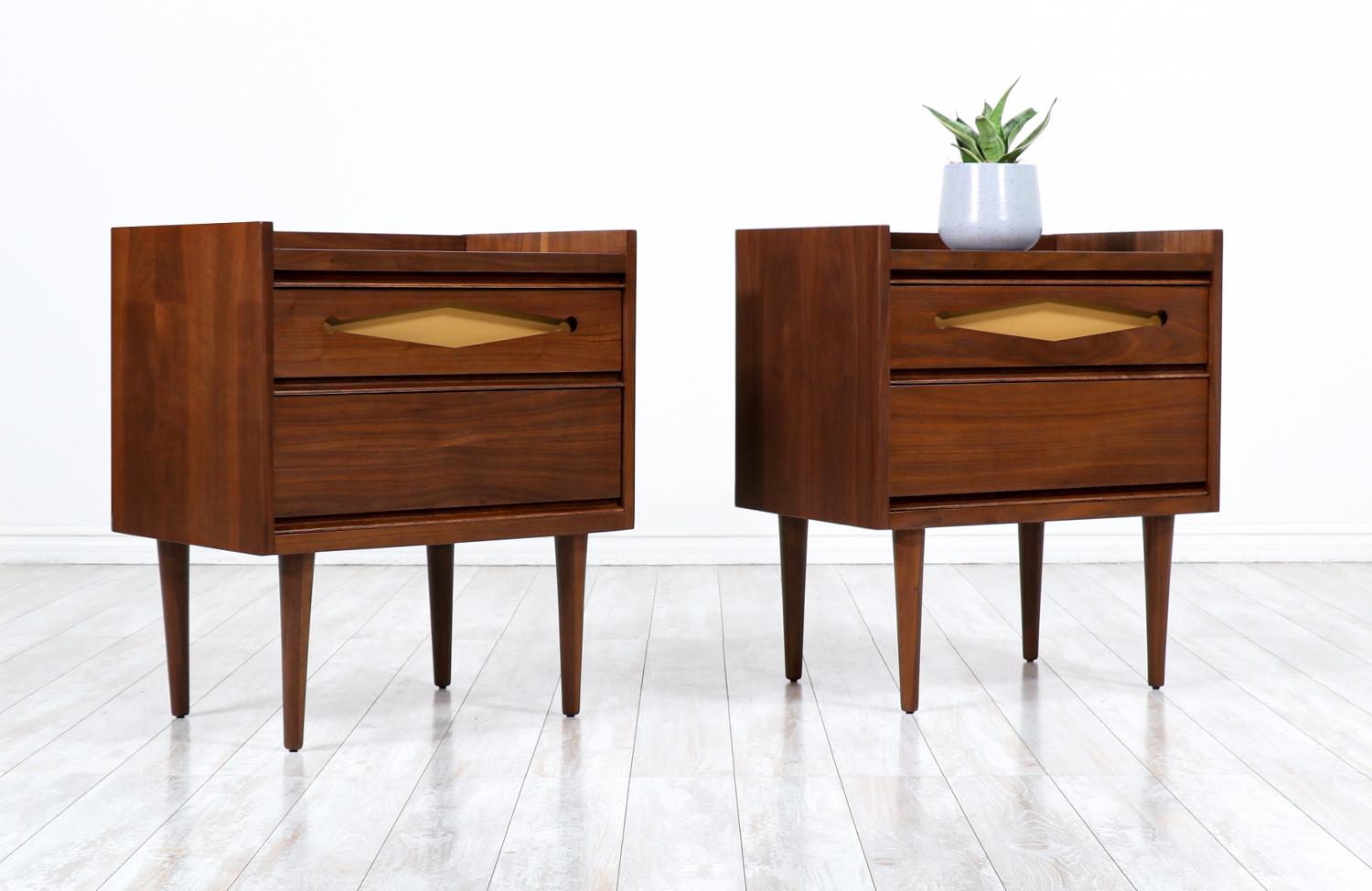 Mid-Century Modern walnut night stands with Lacquered accent drawers.