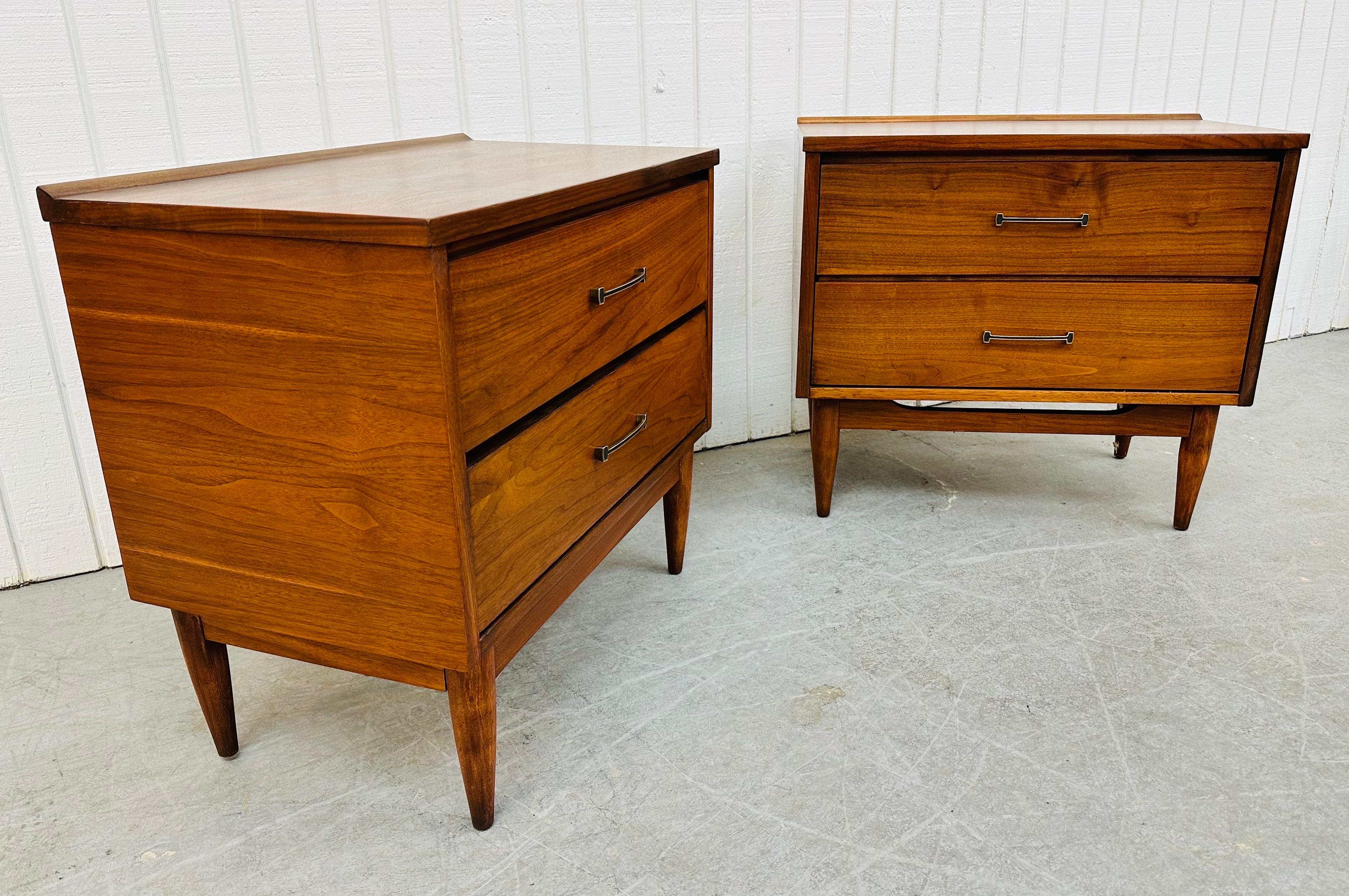 This listing is for a pair of Mid-Century Modern Walnut Nightstands. Featuring a straight line design, curved back edge, two drawers for storage, original hardware, and a beautiful walnut finish. This is an exceptional combination of quality and