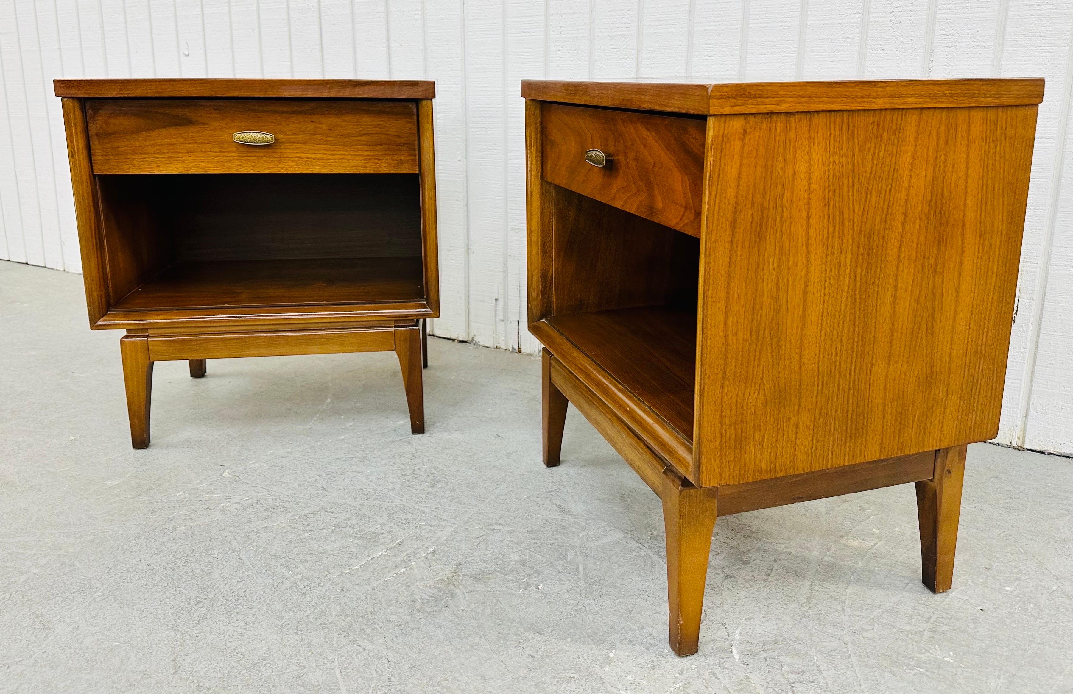 This listing is for a pair of Mid-Century Modern Walnut Nightstands. Featuring a straight line design, single drawer with original hardware, open storage space at the bottom, modern legs, and a beautiful walnut finish. This is an exceptional