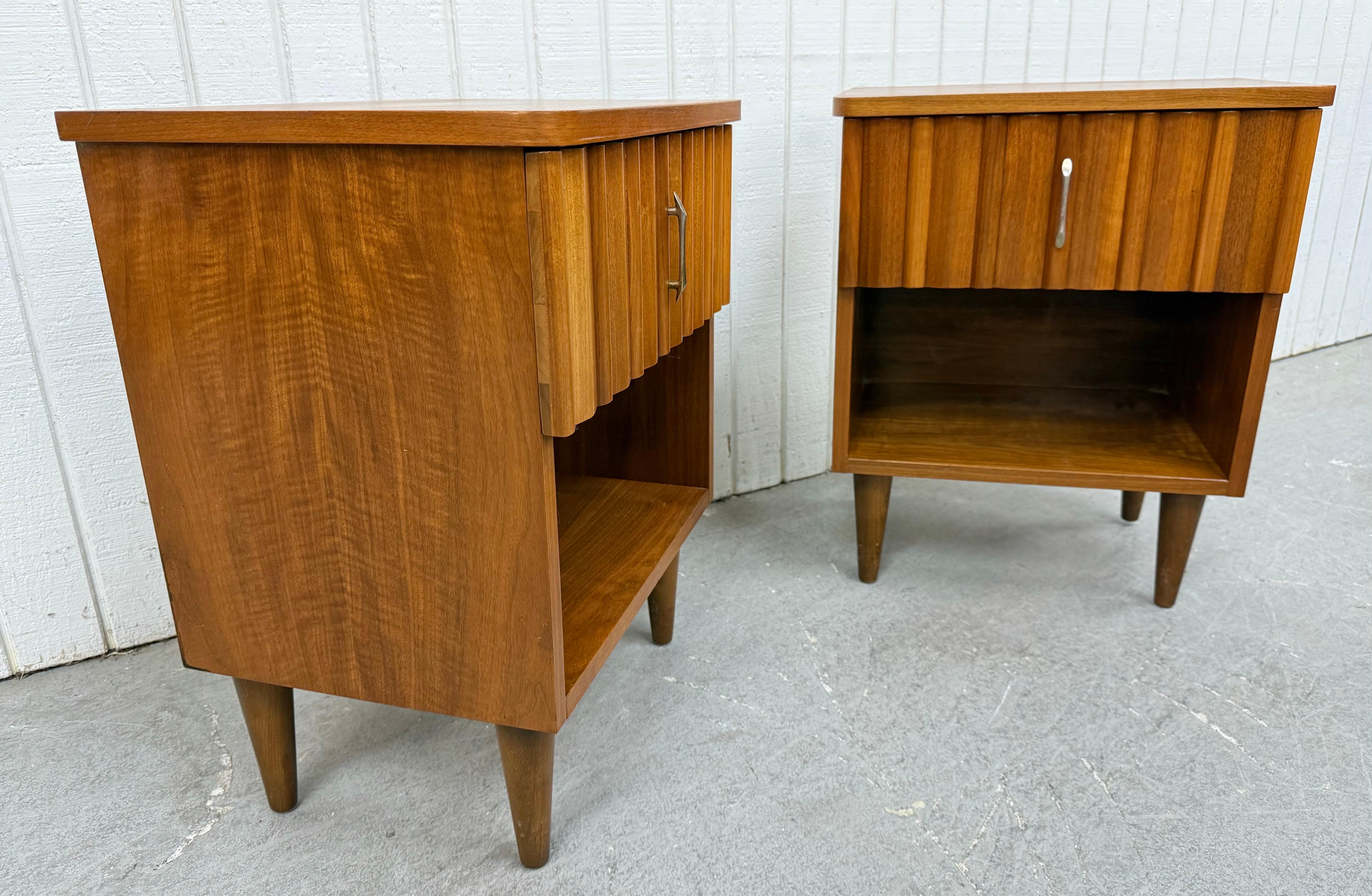 This listing is for a pair of Mid-Century Modern Walnut Nightstands. Featuring a straight line design, single drawer with original hardware, open storage space at the bottom, modern legs, and a beautiful walnut finish! This is an exceptional