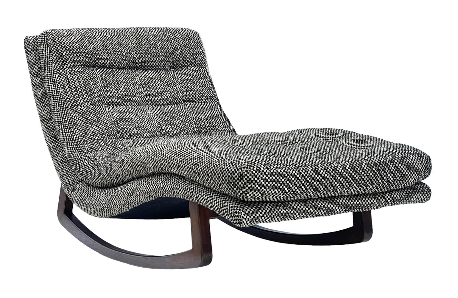 A super fun & super cool rocking chaise lounge from the 1970's. It features solid walnut runners and its original black & white tweed upholstery. 