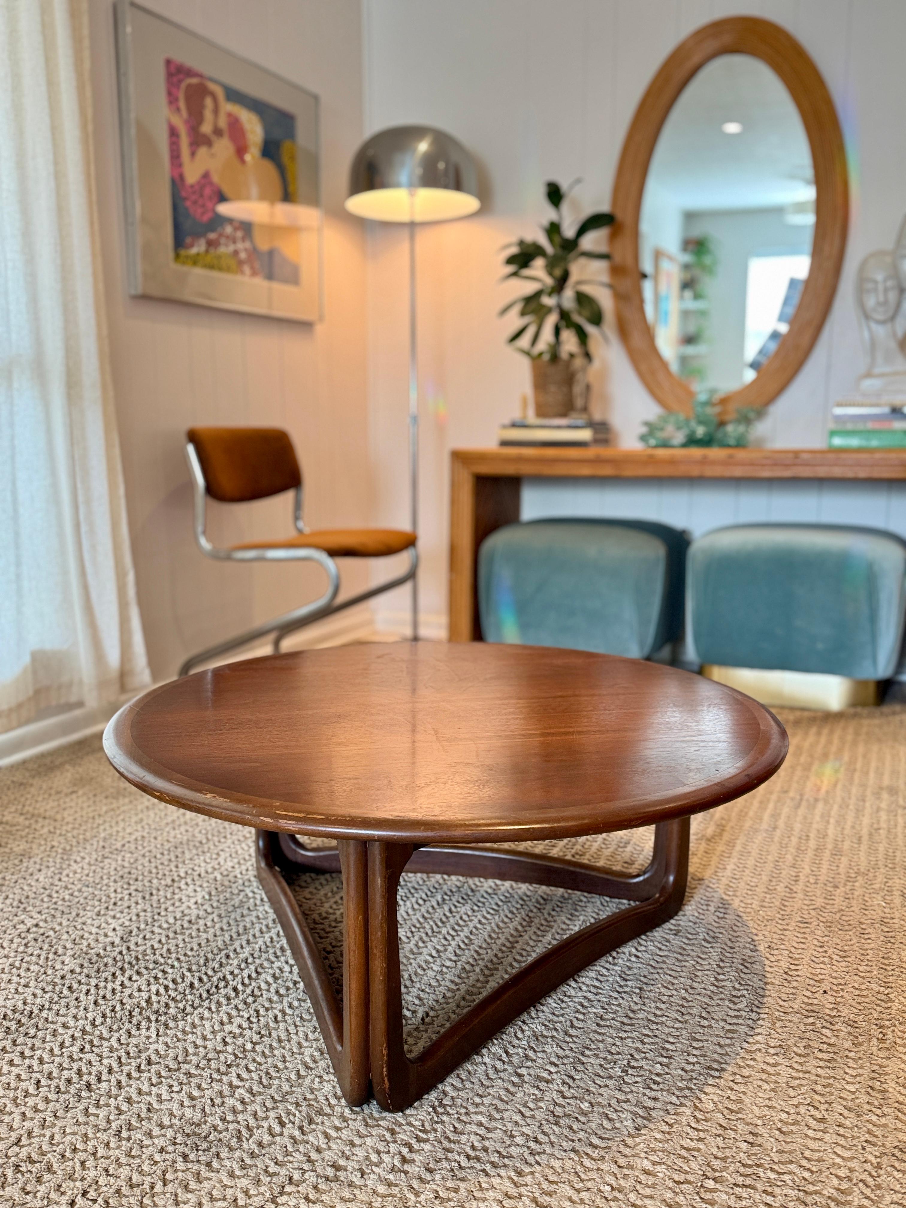 Mid century modern walnut and fruitwood round coffee table by Lane from the Perception series, circa 1960s. Featured gorgeous walnut radial veneer wood and solid ash wood curved legs. Overall in good original condition. Some cosmetic wear as seen in