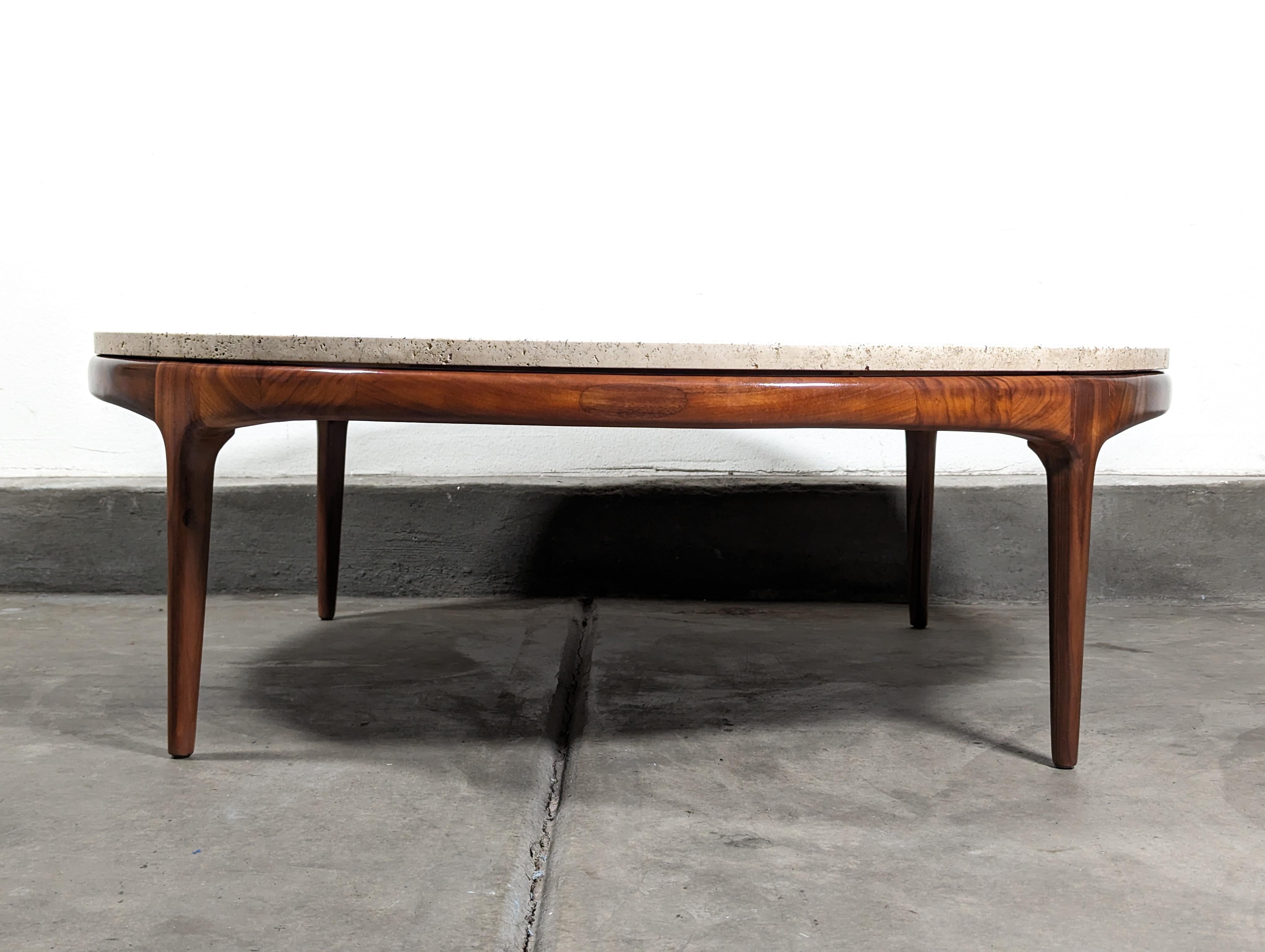 We present to you an exquisite piece of design history - a vintage mid-century modern coffee table by renowned maker, Lane Furniture, crafted in the 1960s. This timeless piece is built to last, with a solid walnut construction and a distinctive