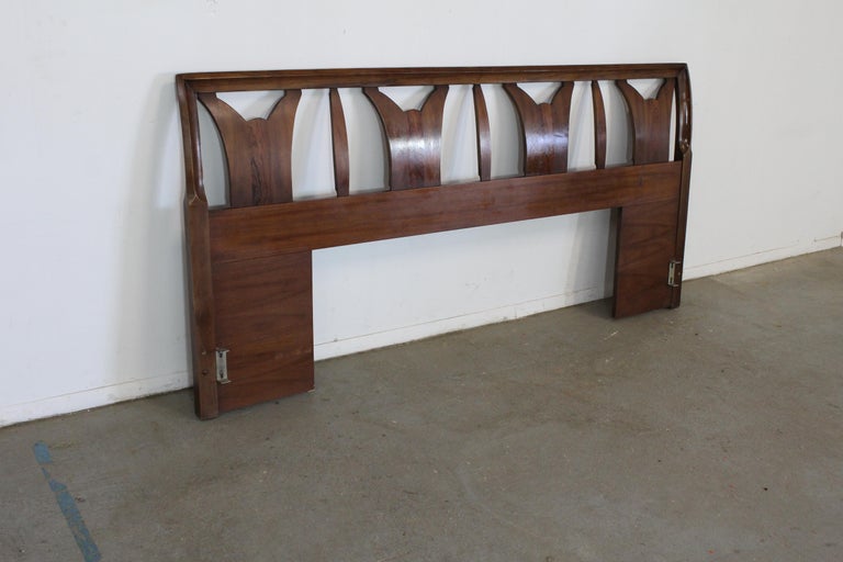 Mid-Century Danish Modern walnut full size headboard.

Offered is a vintage Mid-Century Modern walnut sculpted king size bed/headboard. Looks to be walnut, featuring signature sculpted patterns adorning the front. It is in very good, structurally