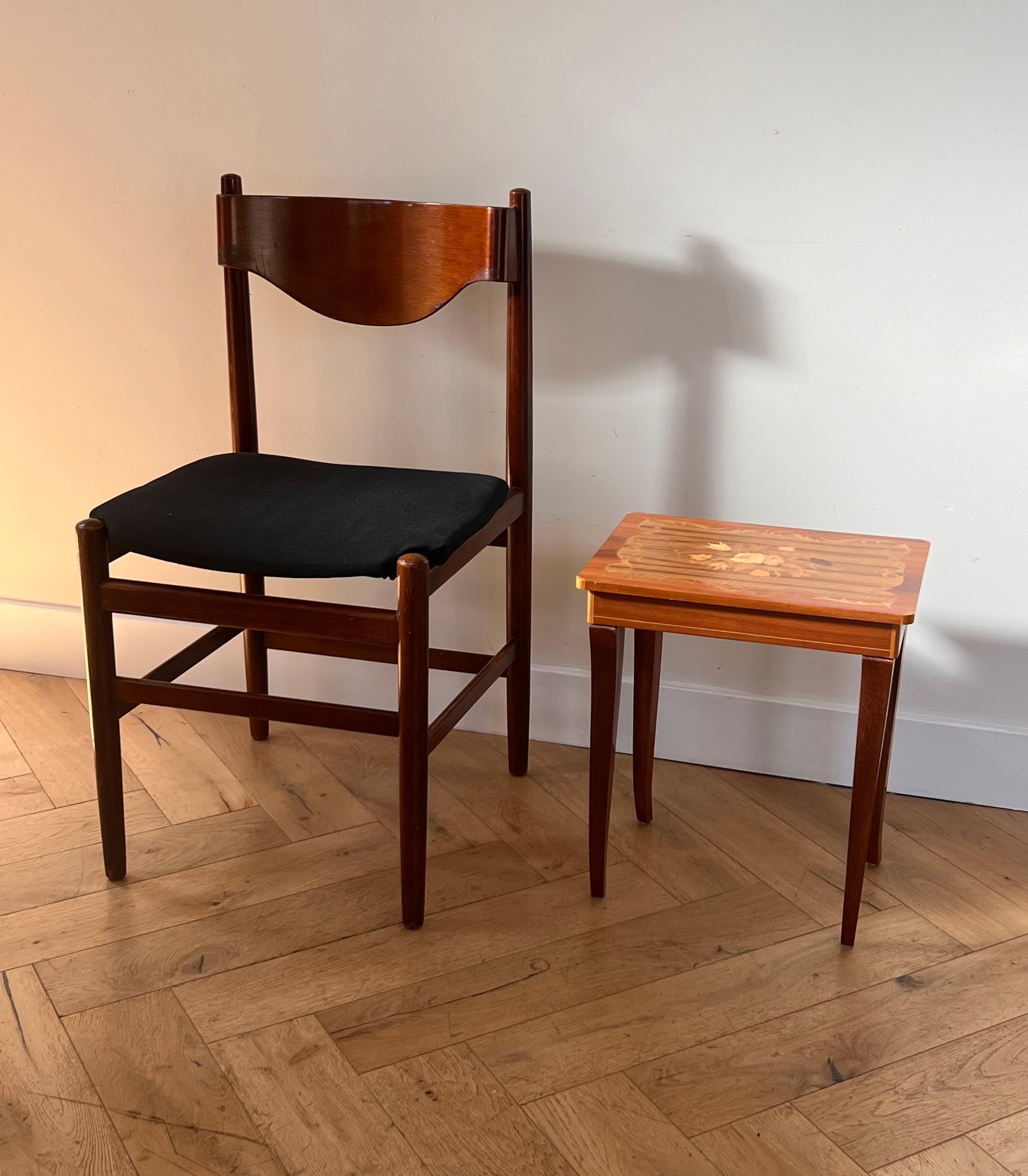 A Danish modern side chair by Borneo Int’l, 1960s. Frame is walnut and the upholstery is a licorice-hued cotton. The back rest of the chair is bent into a wonderfully unique undulating pattern. Commerce CA via Denmark. Original label intact. Wear