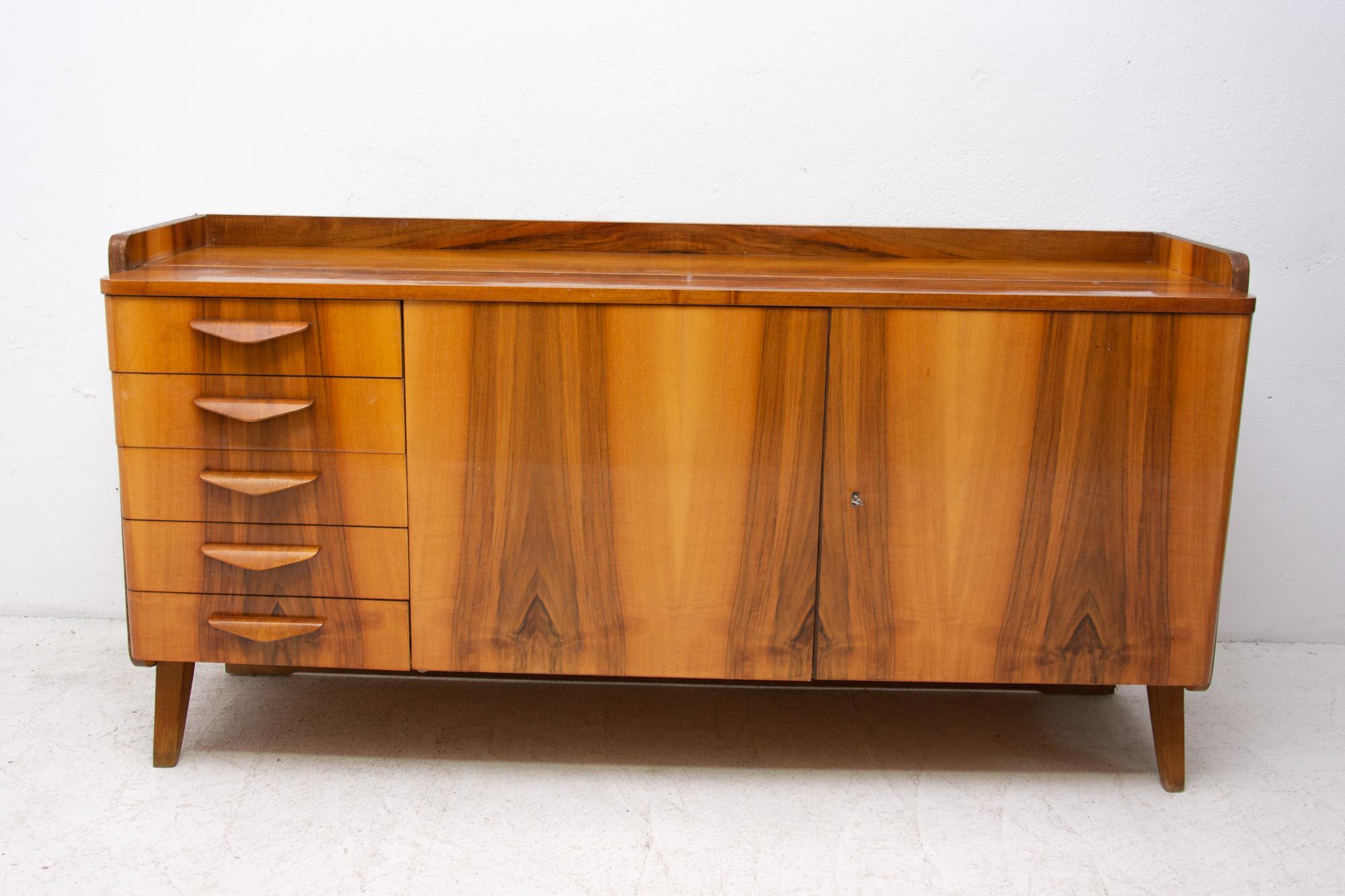 Mid-Century Modern walnut sideboard by Frantisek Jirak for Tatra nabytok. Made in the former Czechoslovakia during the 1960s. The sideboard was part of the living room set. The furniture is primarily intended as a sideboard, but it can also be used