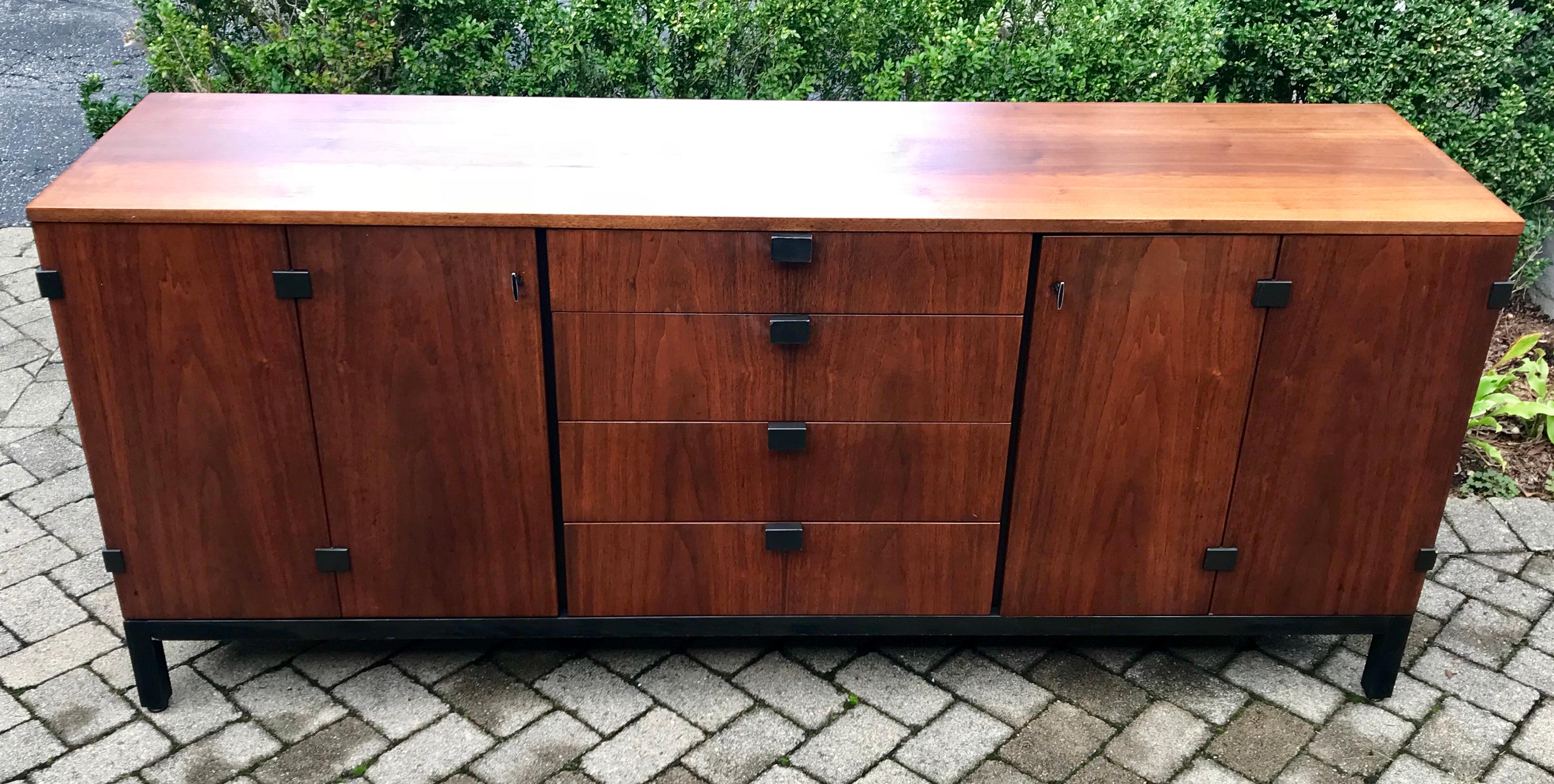 Beautiful walnut sideboard designed by Milo Baughman for Directional.

Milo Baughman was one of the most agile and adept modern American furniture designers of the late 20th century. A prolific lecturer and writer on the benefits of good design —
