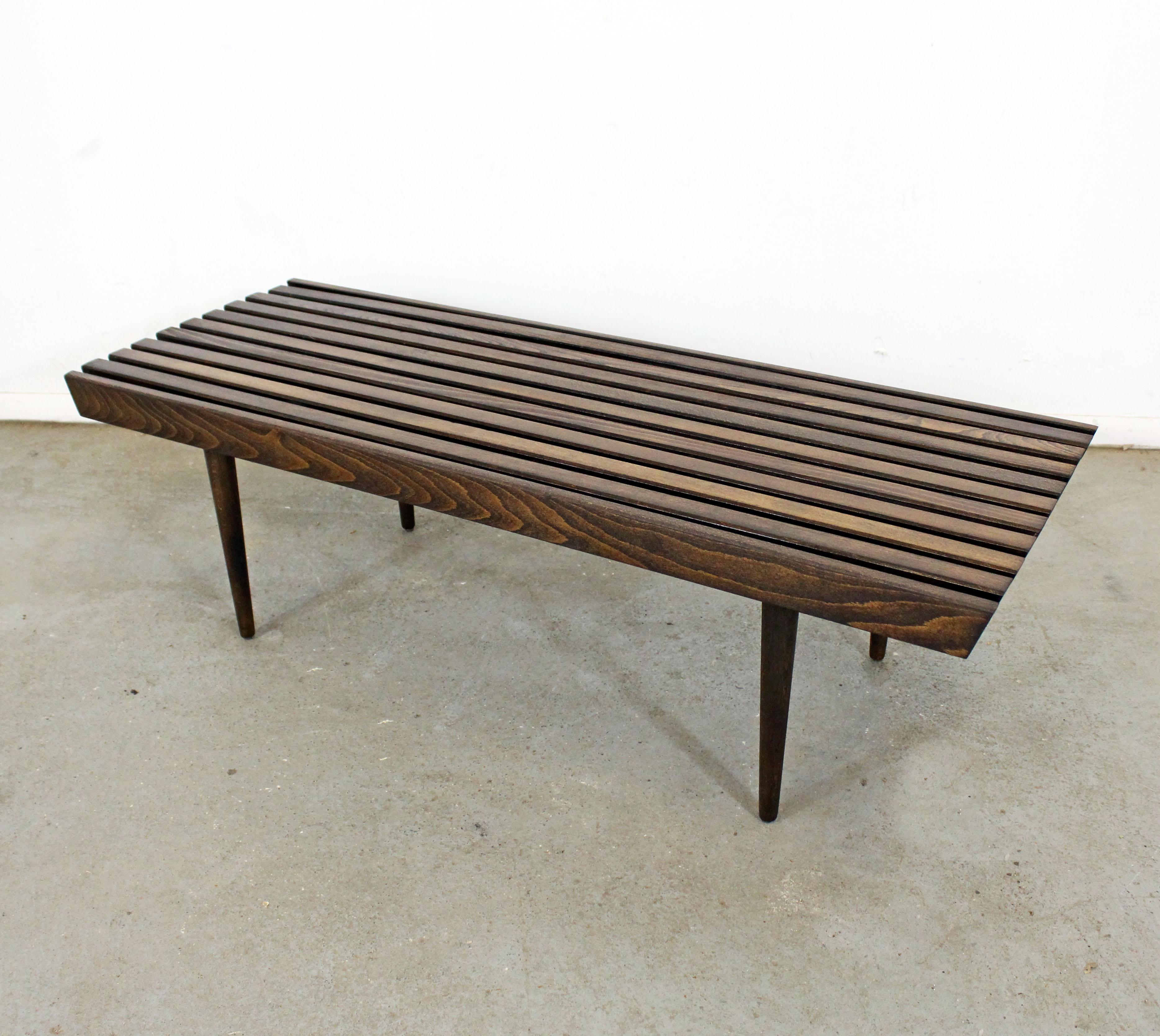 What a find. Offered is a vintage Mid-Century Modern walnut coffee table. Has been refinished and is in good condition with minor surface wear/chips. It is structurally sound and stabile. It is not signed.

Dimensions:
48