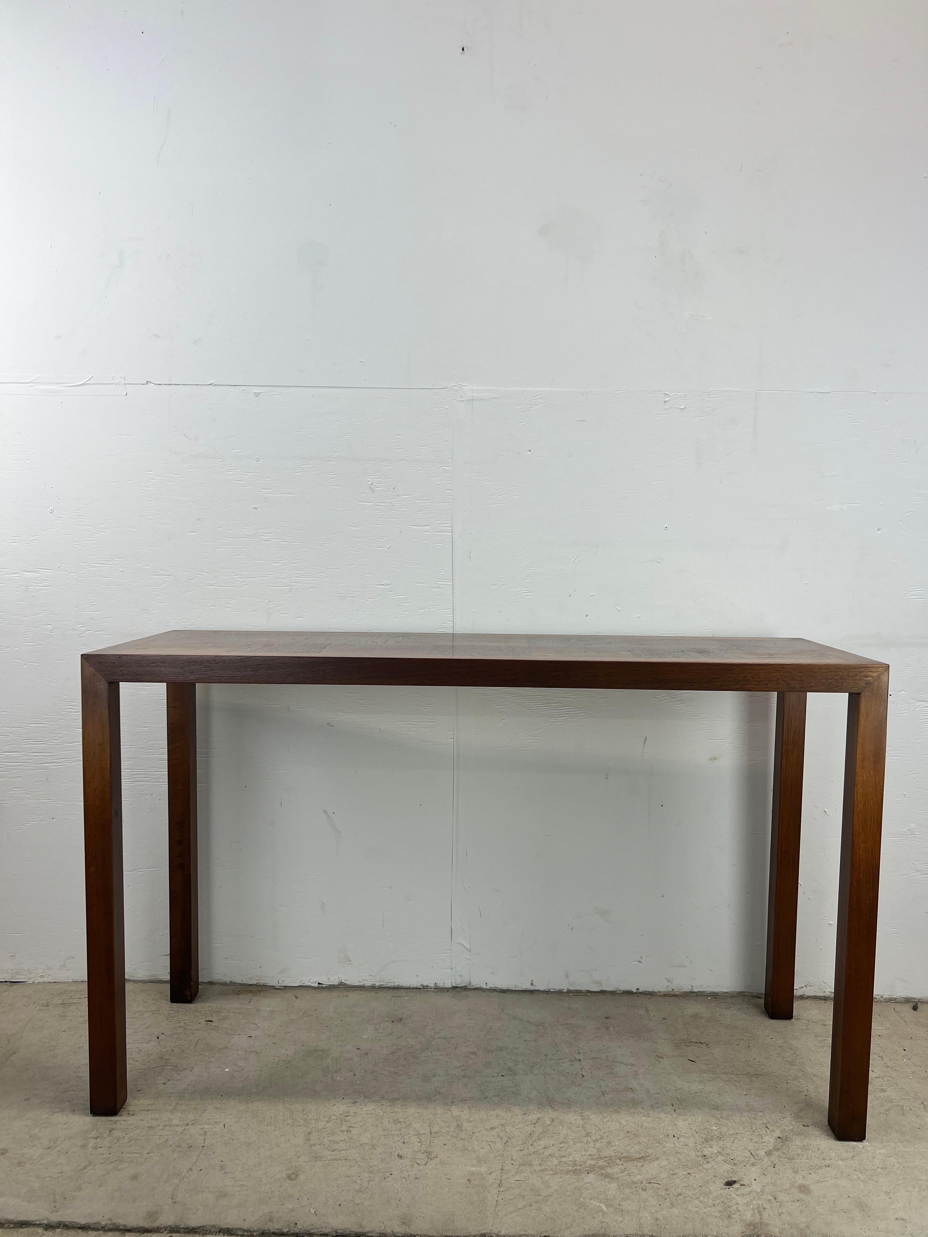 This mid century modern console / sofa table by Lane Furniture features hardwood construction, walnut veneer with original finish, and tall legs providing very clean lines.

 Dimensions: 48w 16d 29.5h

Condition: Original walnut finish is in